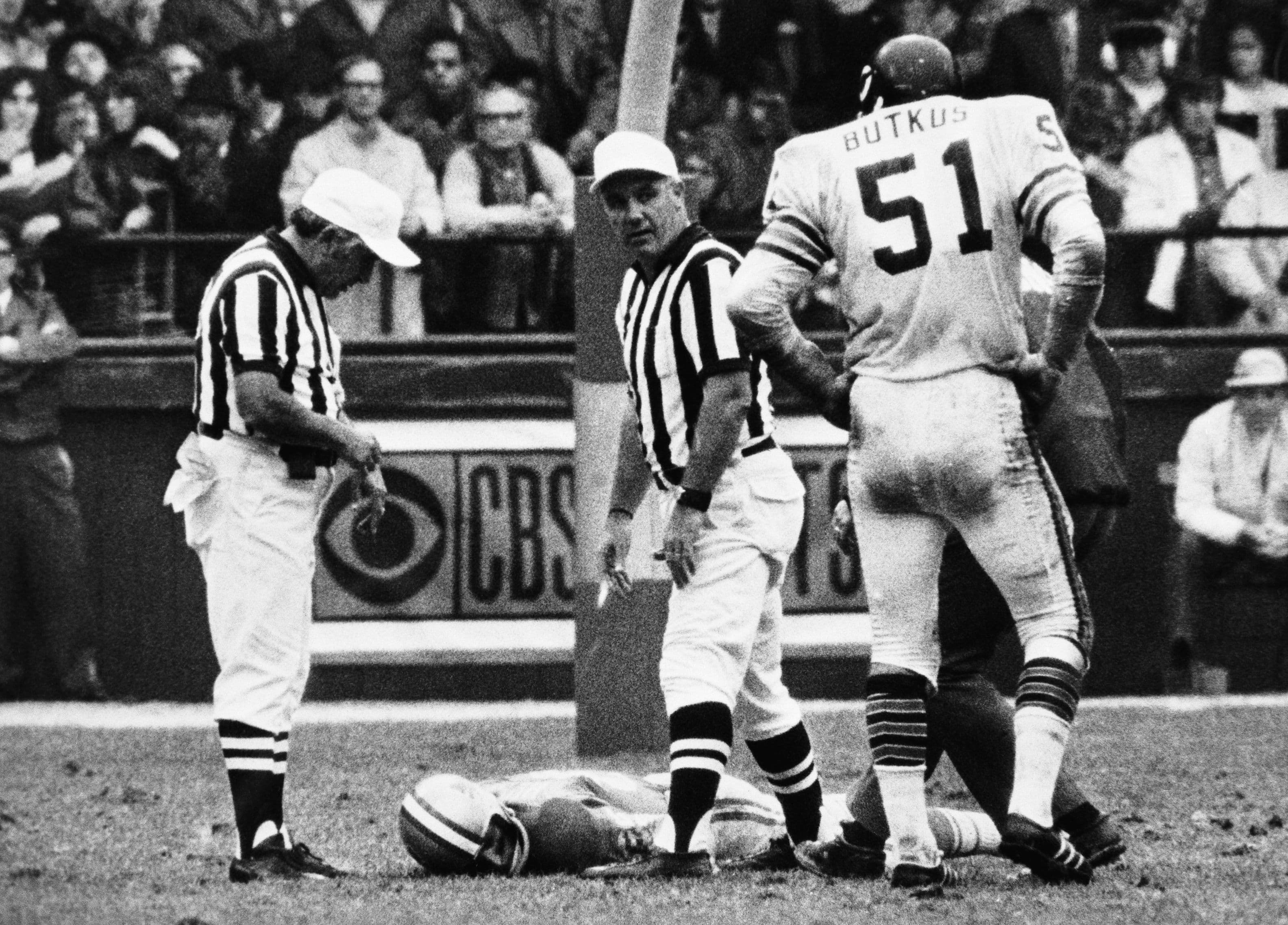 Detroit Lions' wide receiver Chuck Hughes lies on the field at Tiger Stadium