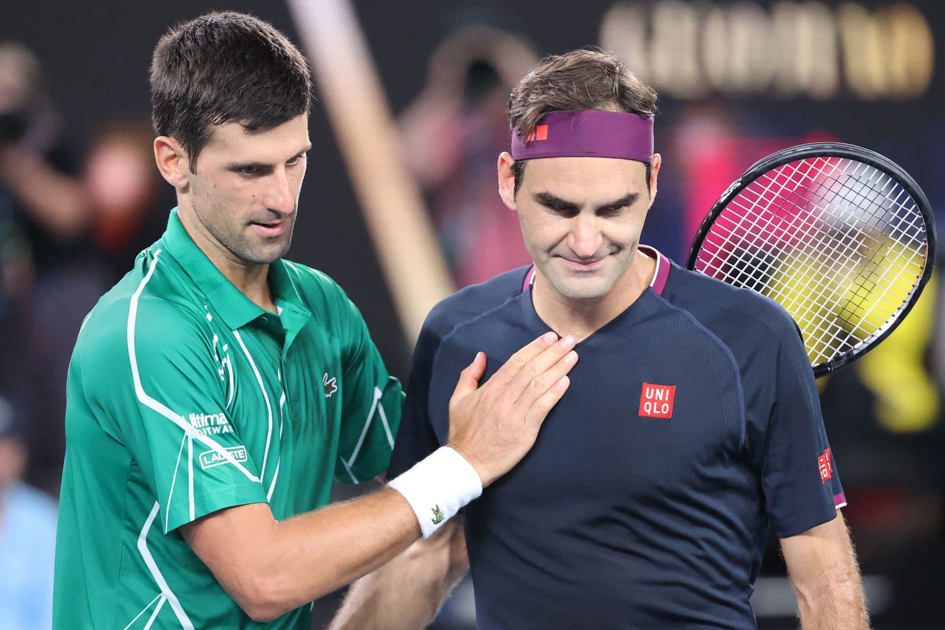 Djokovic pats Roger Federer after his victory during their men's singles semi-final match.jpg