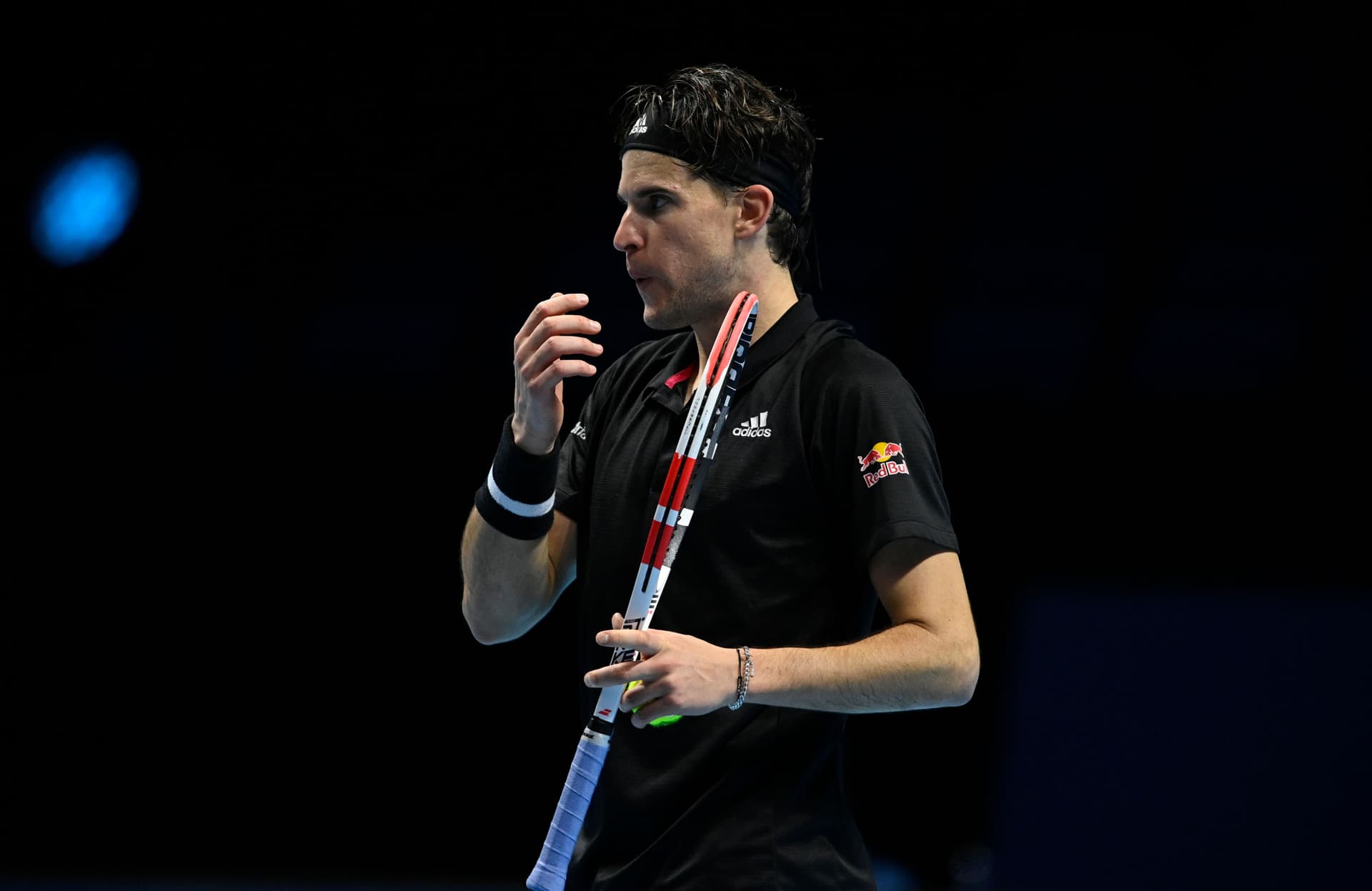 Dominic Thiem of Austria blows on his fingers