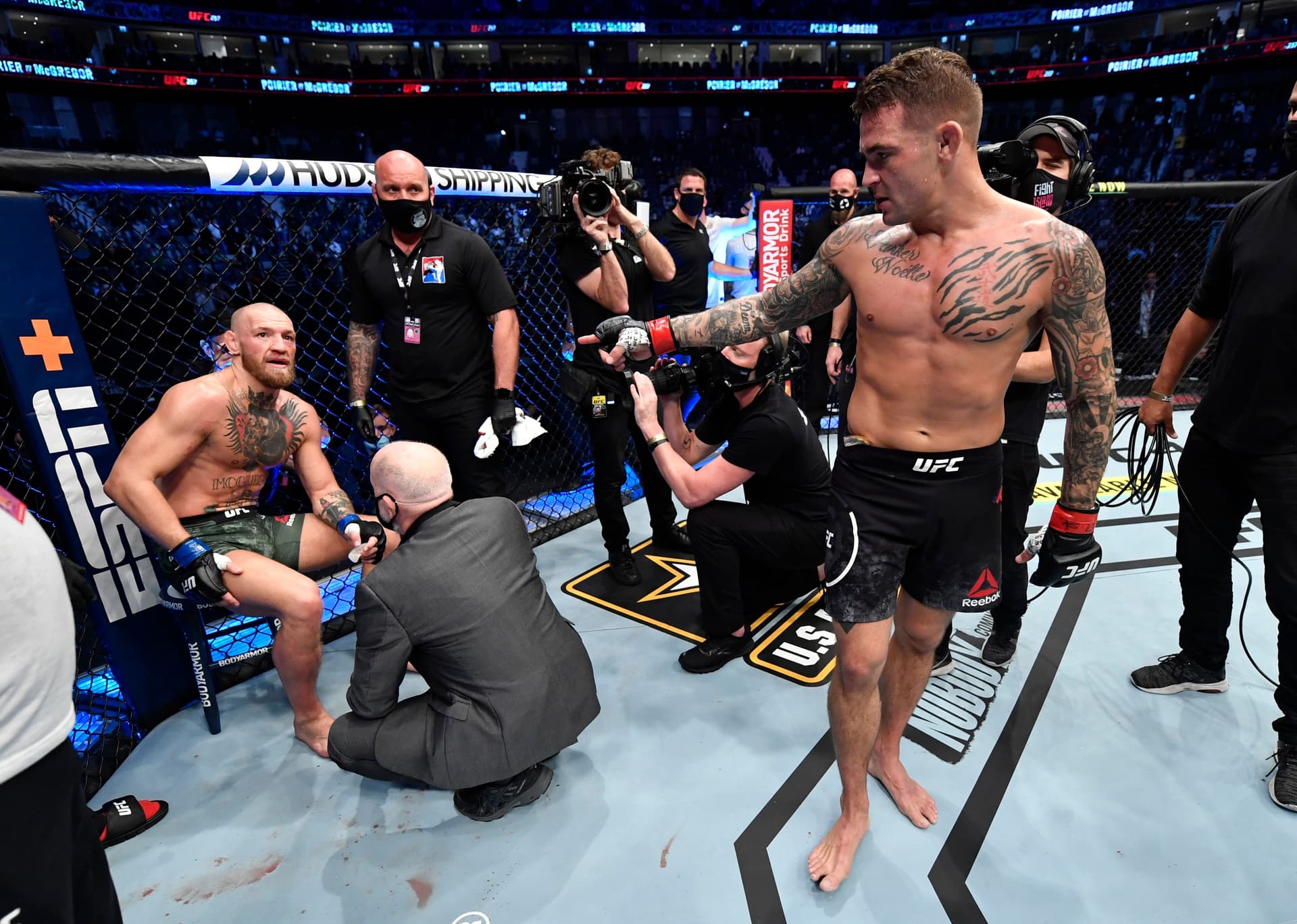 Dustin Poirier greets Conor McGregor