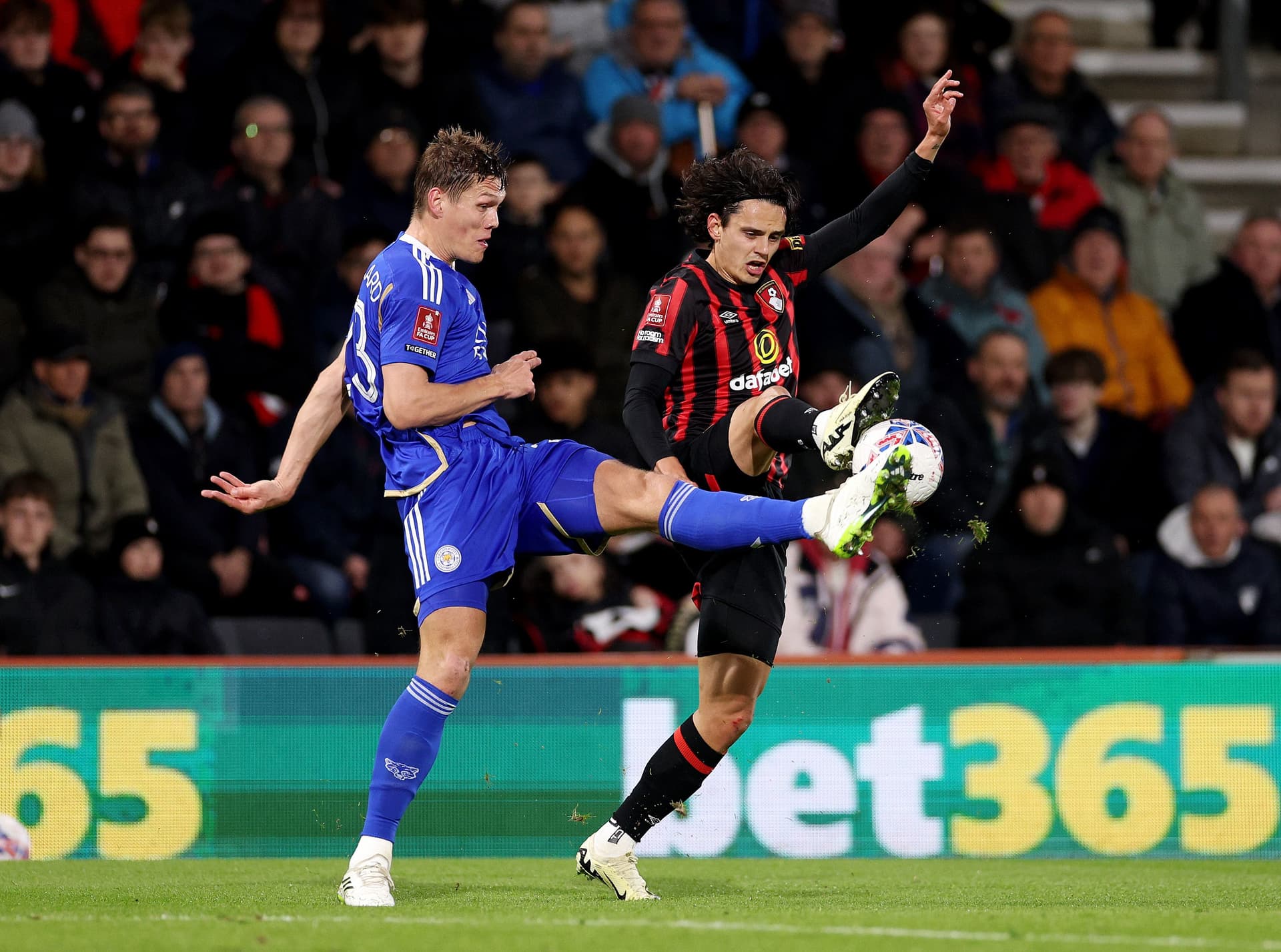Enes Unal of AFC Bournemouth is challenged by Jannik Vestergaard of Leicester City.jpg