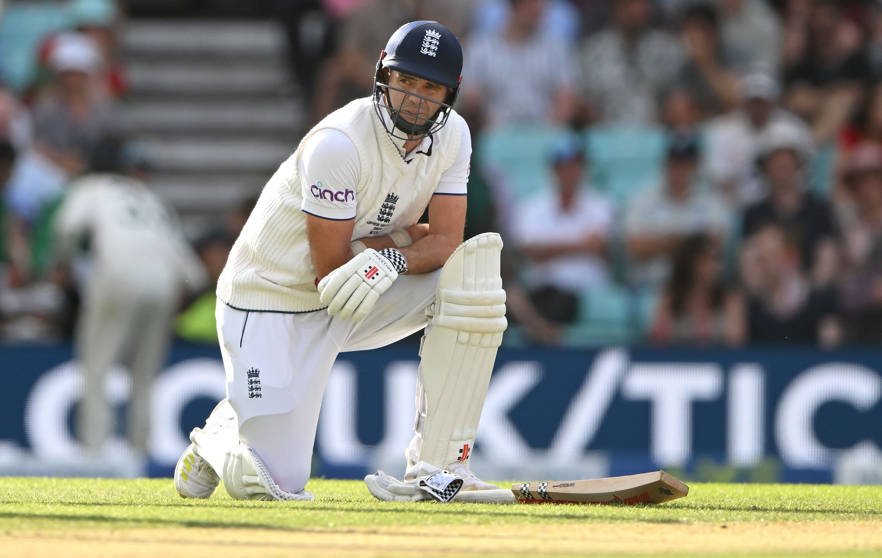 England batsmen James Anderson reacts after being hit on the arm