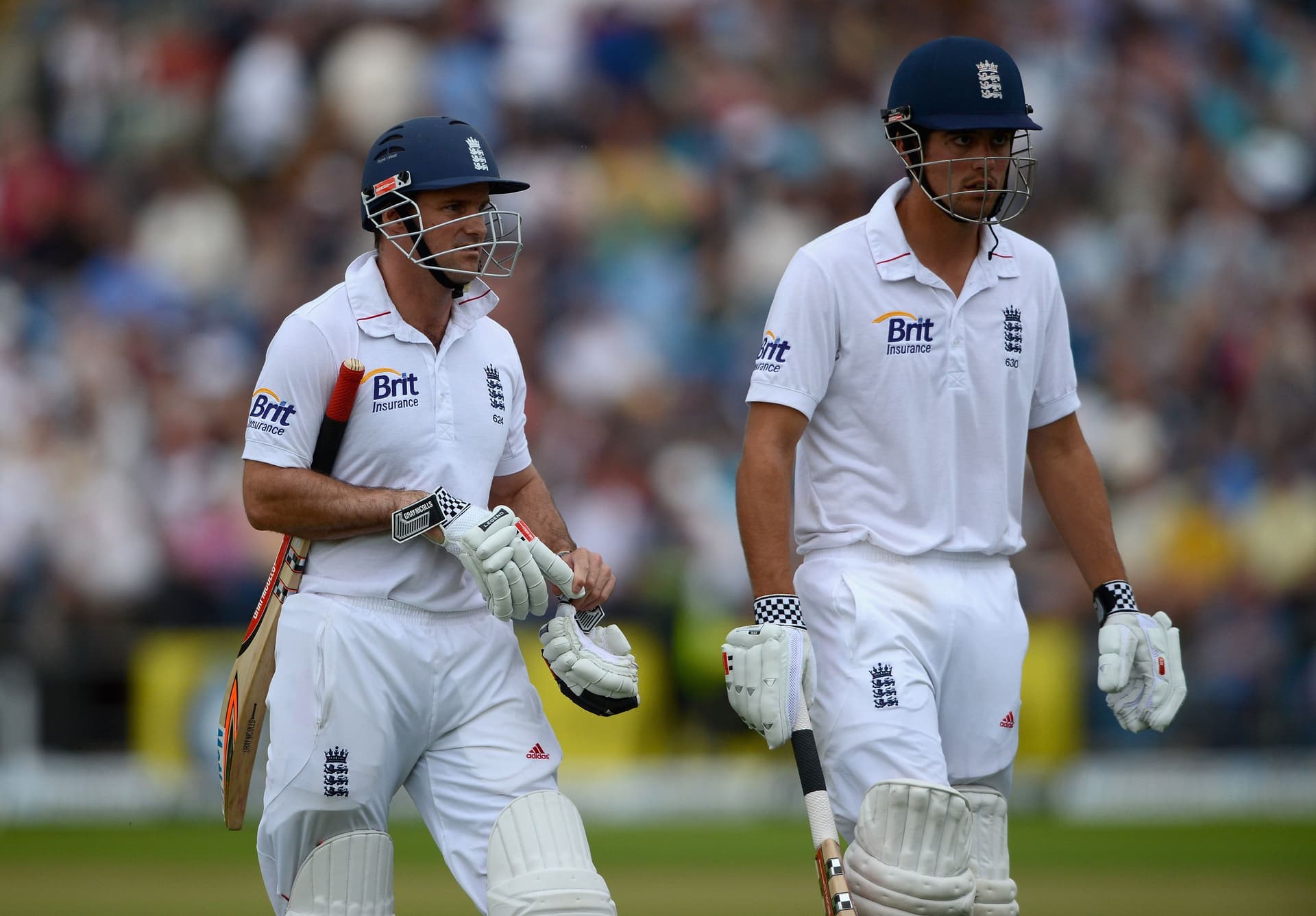 England captain Andrew Strauss and Alastair Cook leave the field