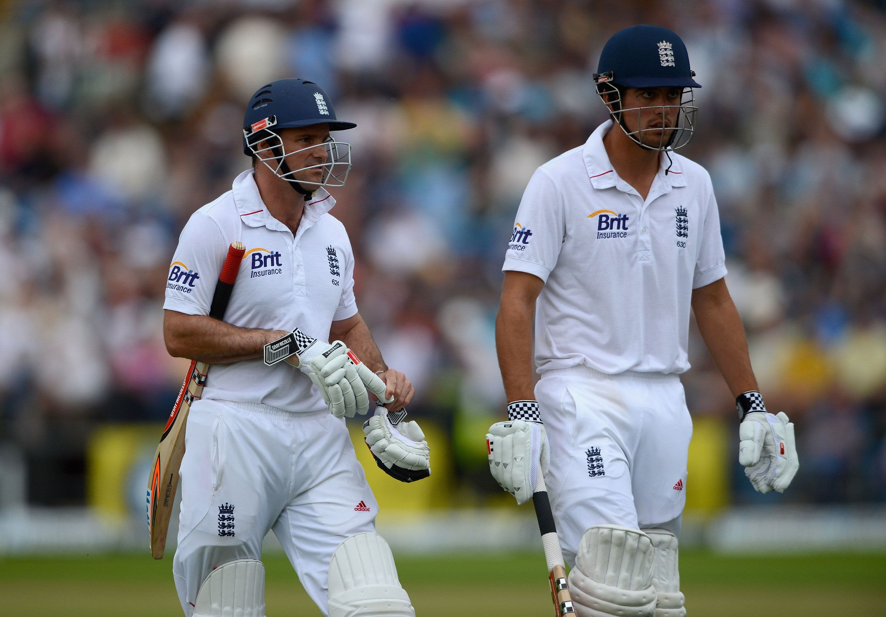 England captain Andrew Strauss and Alastair Cook leave the field