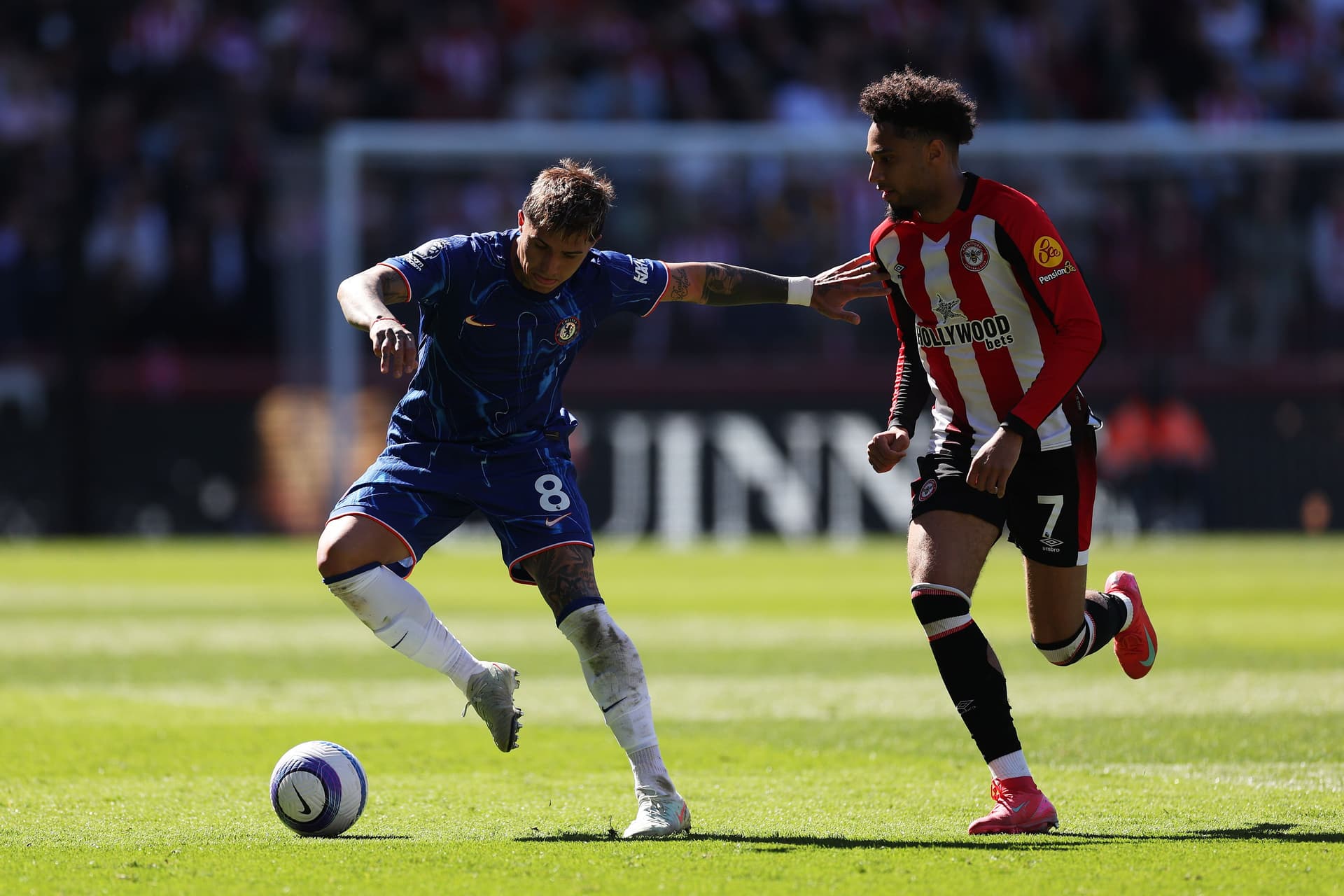 Enzo Fernandez of Chelsea is challenged by Kevin Schade of Brentford