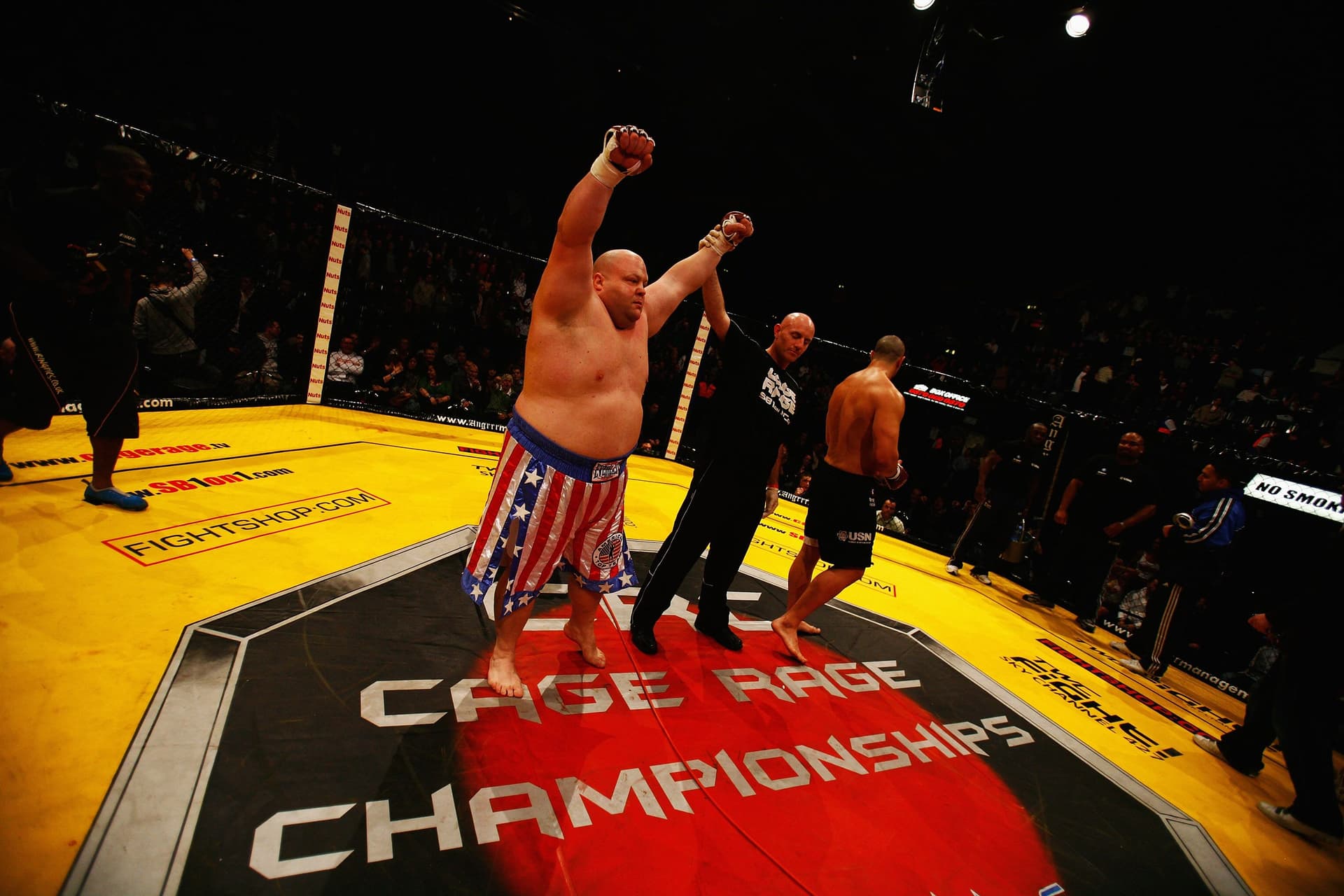 Eric Butterbean Esch raises his arms on being declared the winner against James The Colossus Thompson