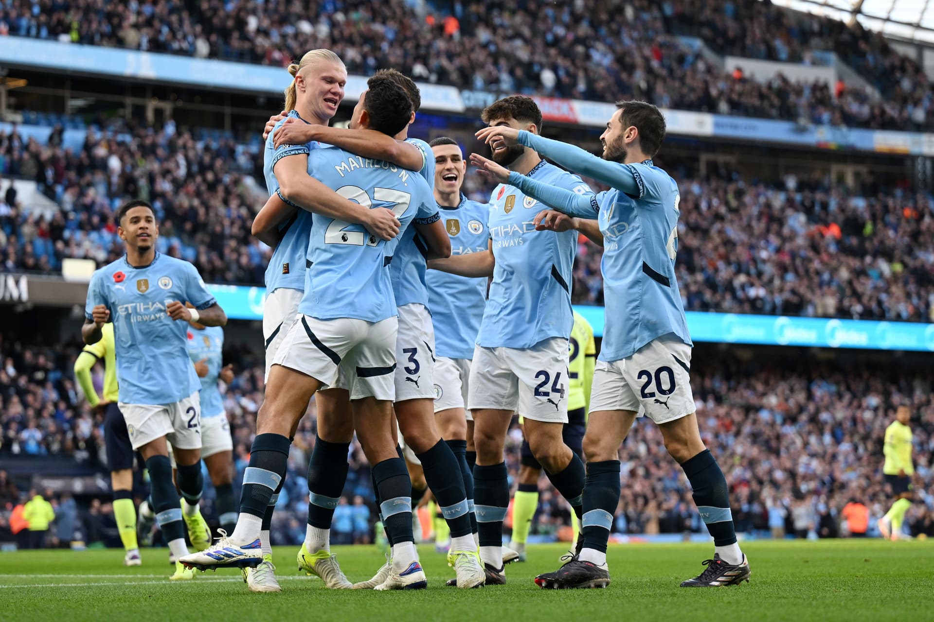 Erling Haaland of Manchester City celebrates scoring his team's first goal with teammates