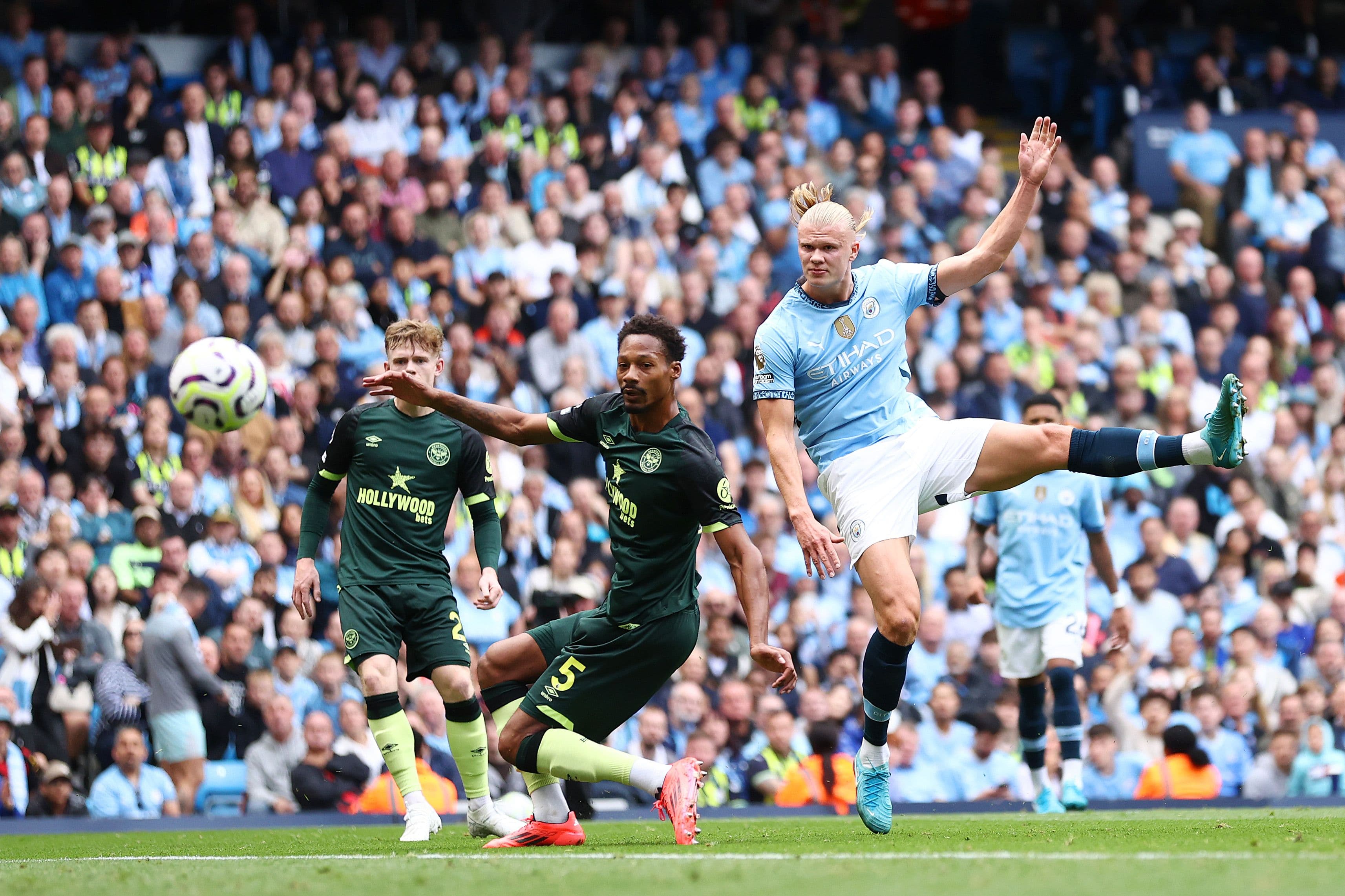 Erling Haaland of Manchester City scores his team's first goal during the Premier League match