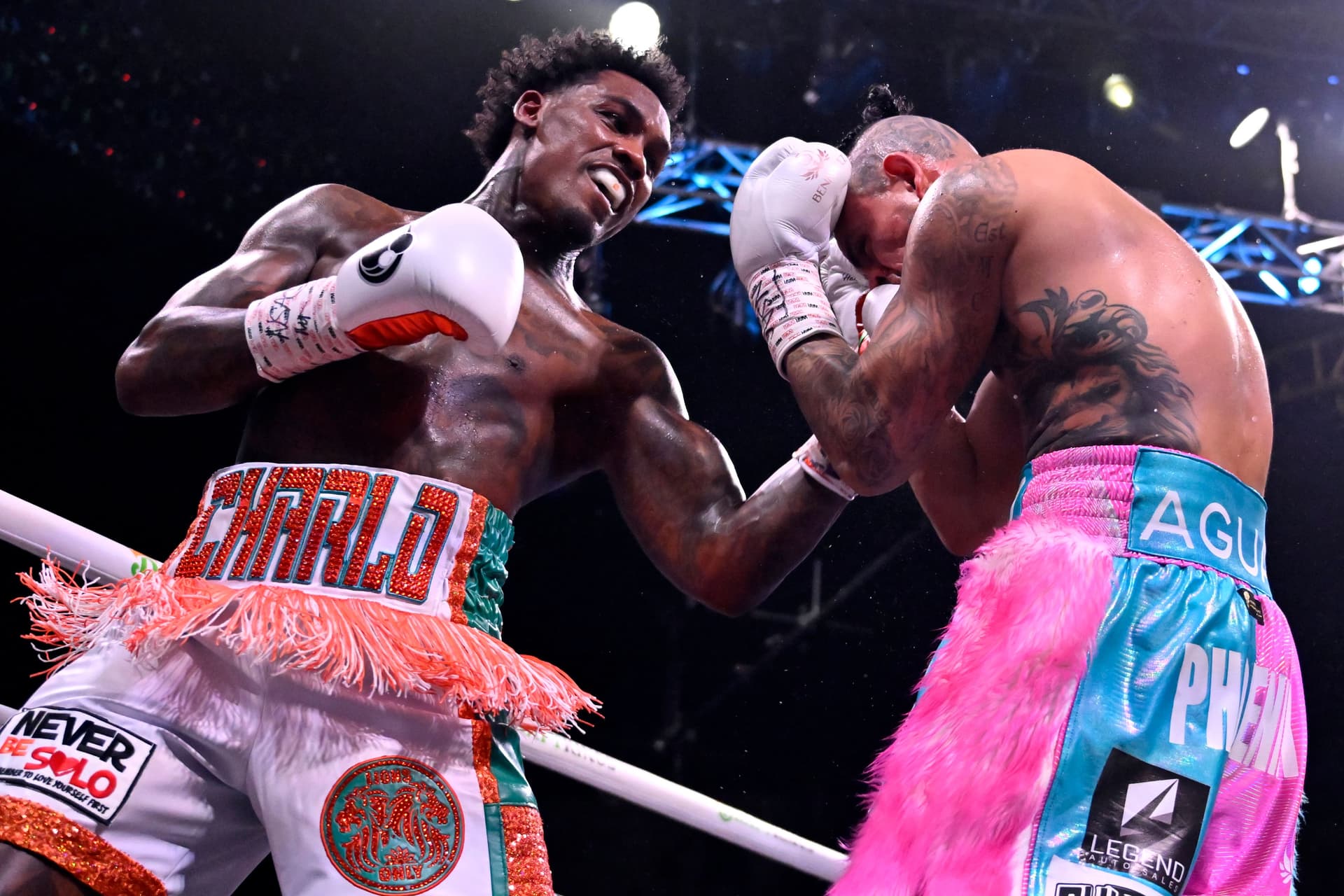Ermall Charlo fights Jose Benavidez Jr. during their middleweight bout.jpg