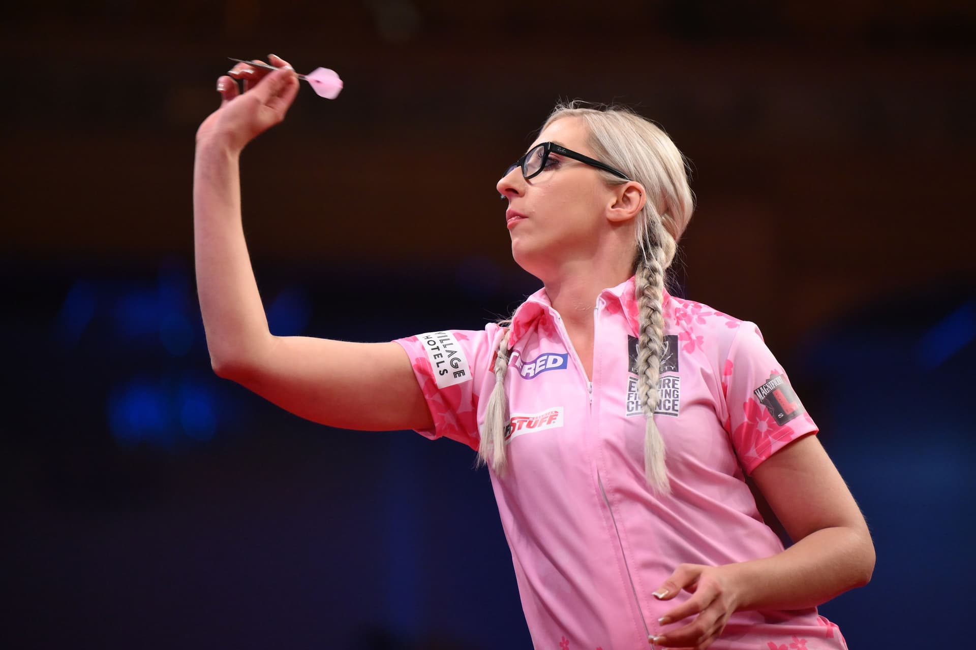 Fallon Sherrock of England throws during her match against Lisa Ashton