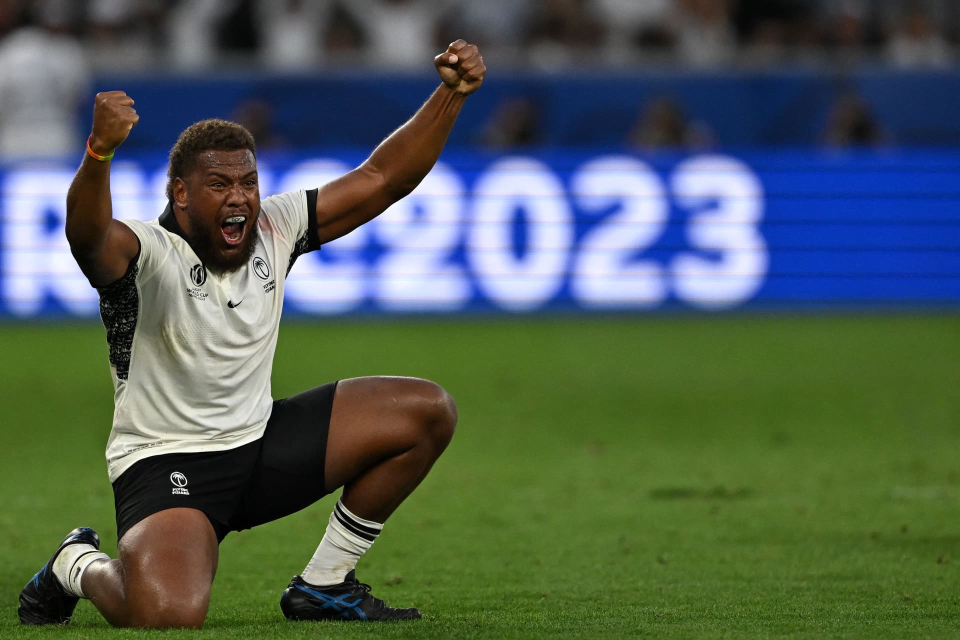 Fiji's hooker Tevita Ikanivere celebrates Fiji's victory