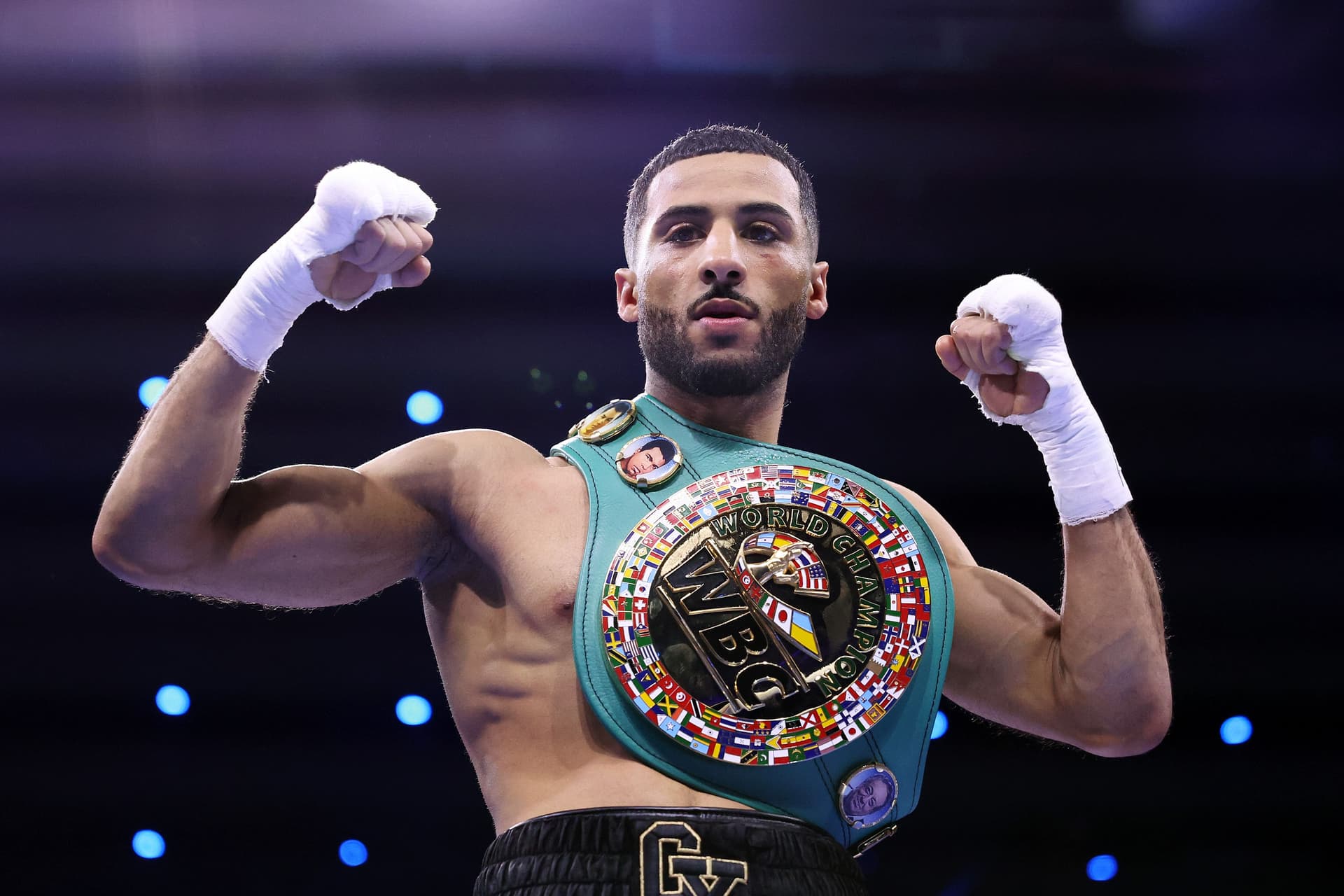 Galal Yafai poses for a photo with the title belt after victory over Sunny Edwards