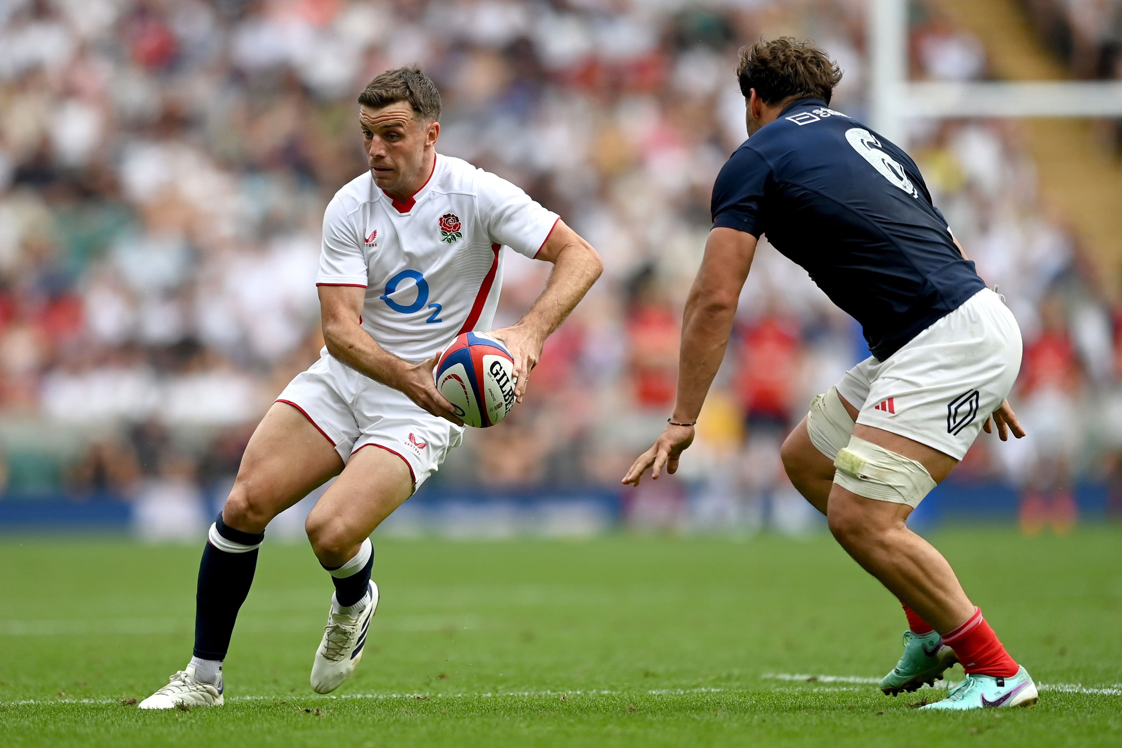 George Ford of England looks to pass the ball during the rugby
