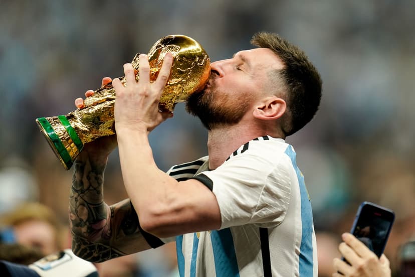 Lionel Messi of Argentina kisses the trophy