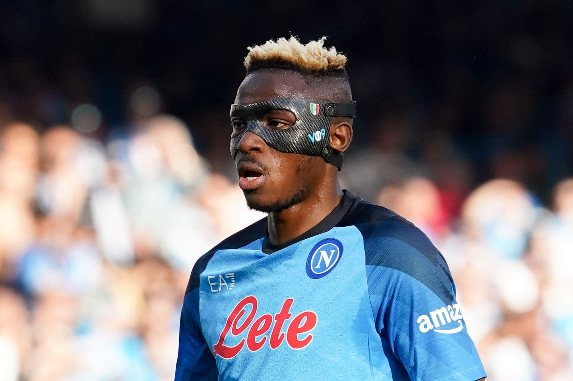 Victor Osimhen of SSC Napoli looks wearing a celebrative mask
