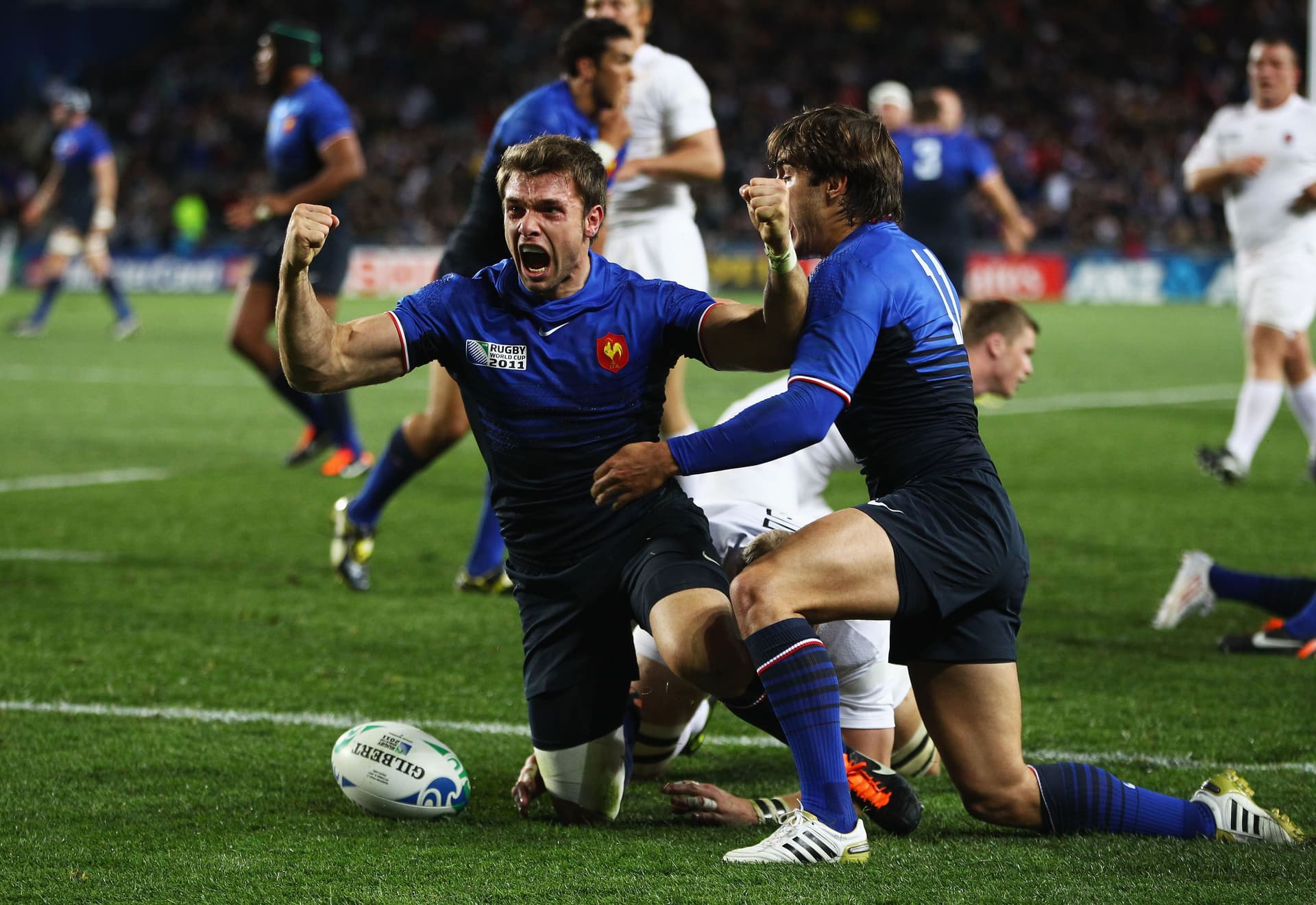 Vincent Clerc of France celebrates his opening try with Alexis Palisson (R)