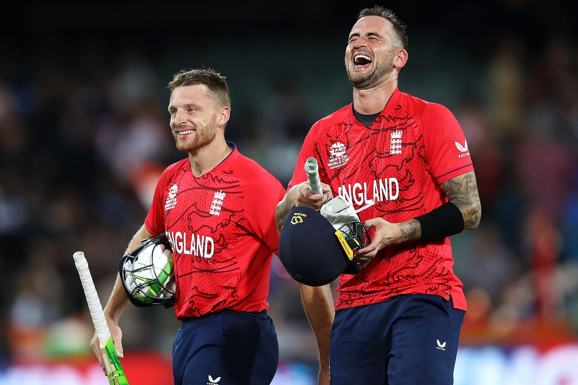 s Buttler and Alex Hales of England share a laugh as they celebrate victory during the ICC Men's T20 World Cup Semi Final match between India and England