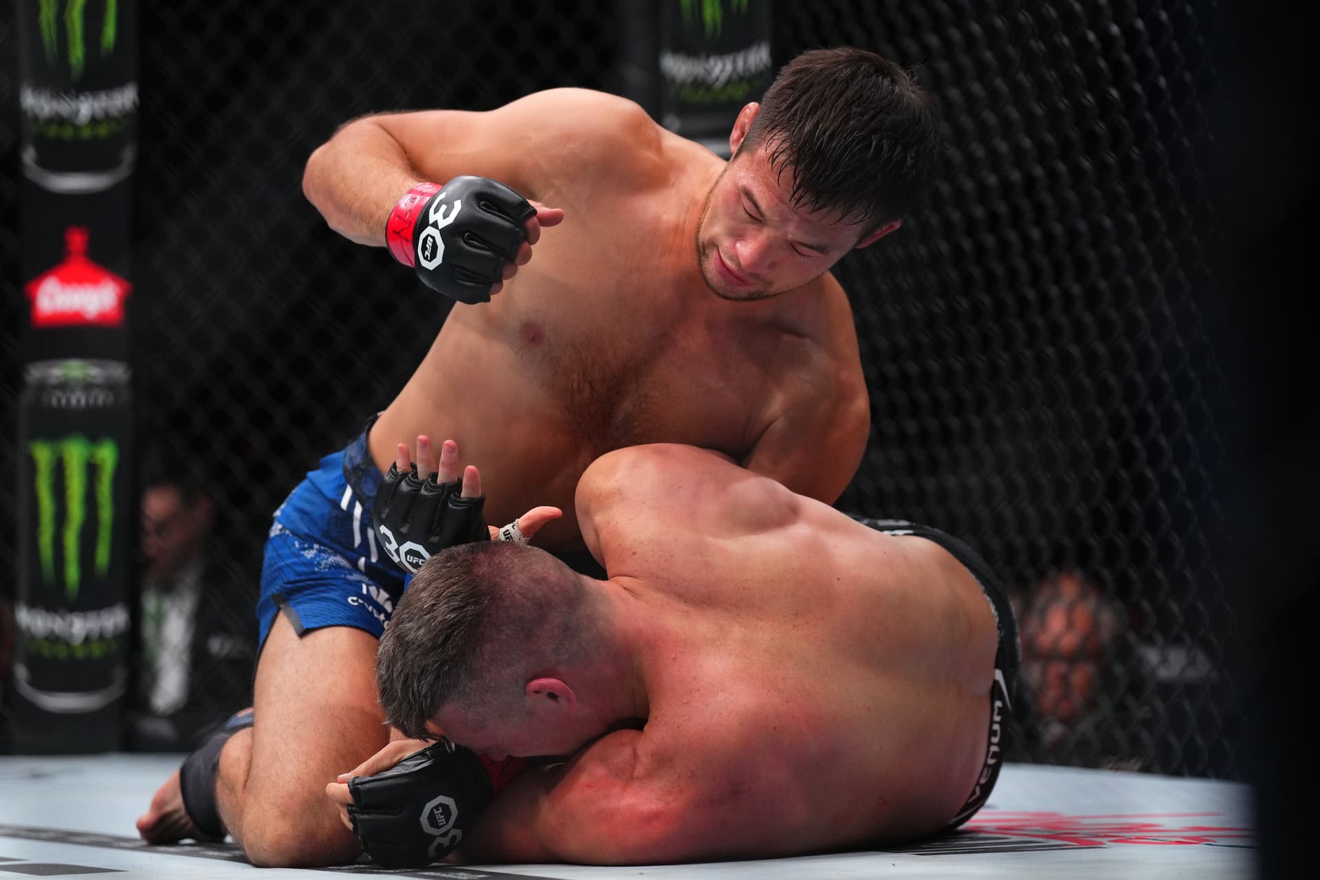 Shavkat Rakhmonov of Uzbekistan punches Stephen Thompson