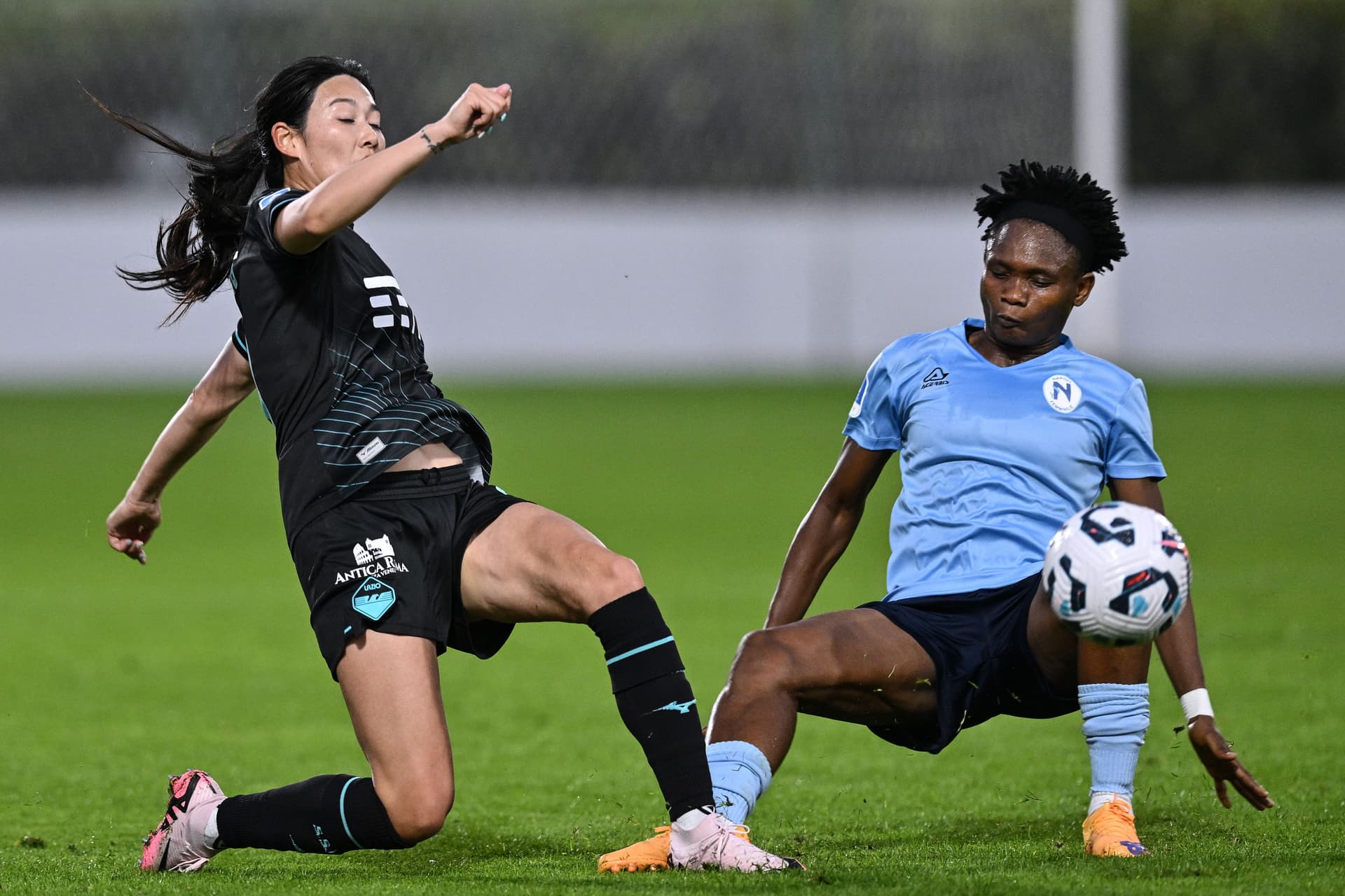 Lina Yang of SS Lazio competes for the ball with Olamide Adugbe of Napoli