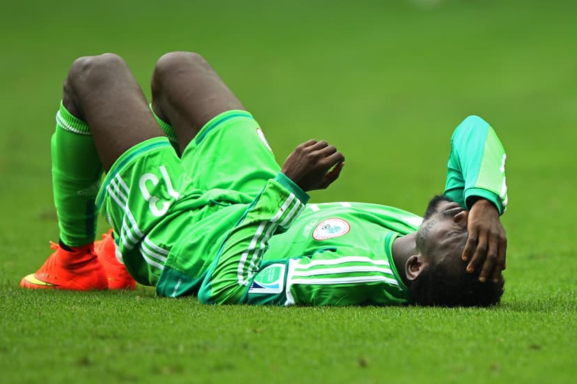 Juwon Oshaniwa of Nigeria lies on the field