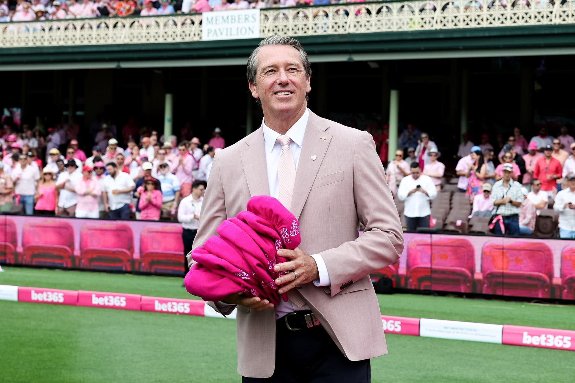 Glenn McGrath poses after receiving the pink caps for the McGrath Foundation