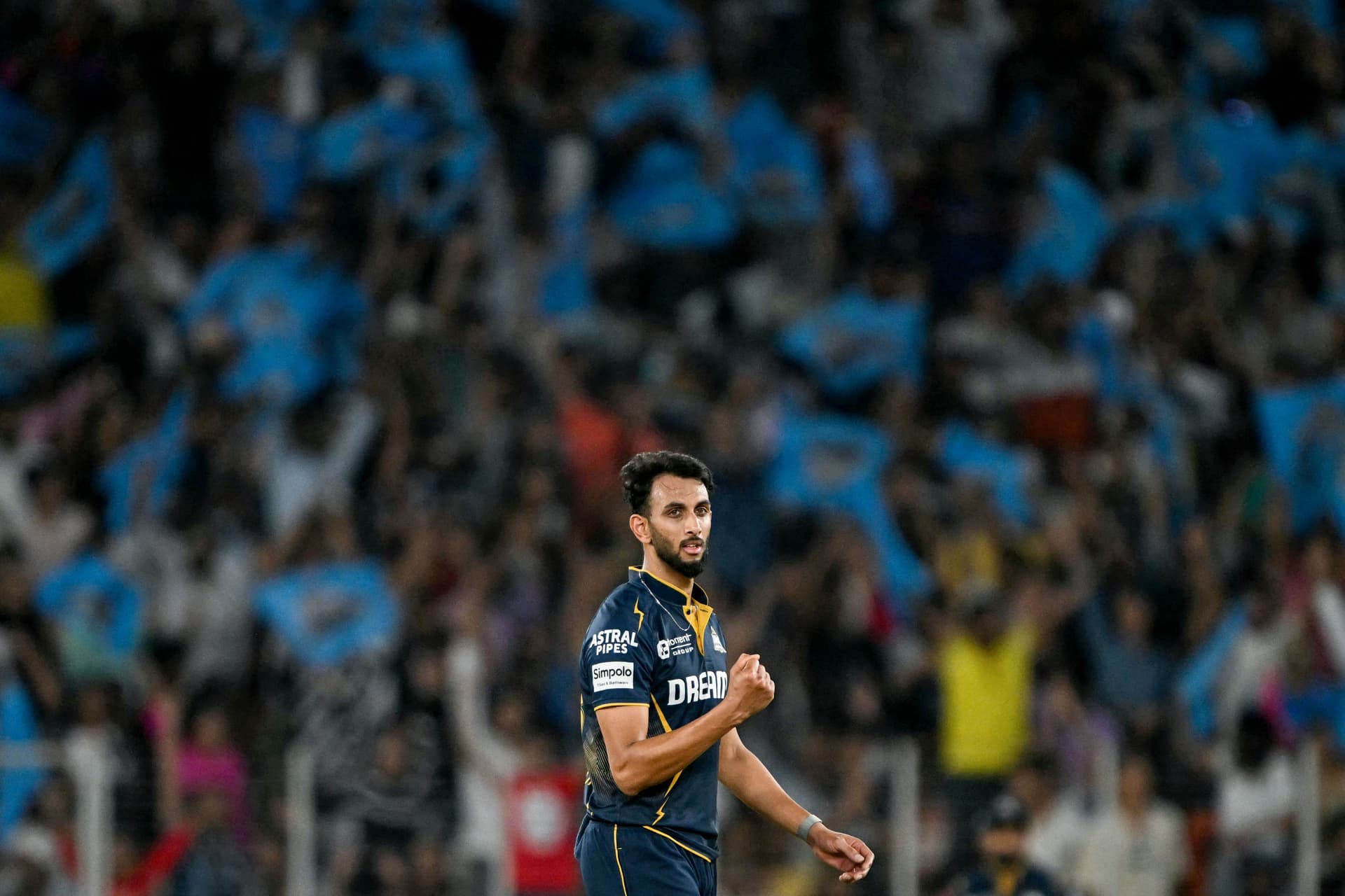 Gujarat Titans' Prasidh Krishna celebrates after taking the wicket of Rajasthan Royals.jpg