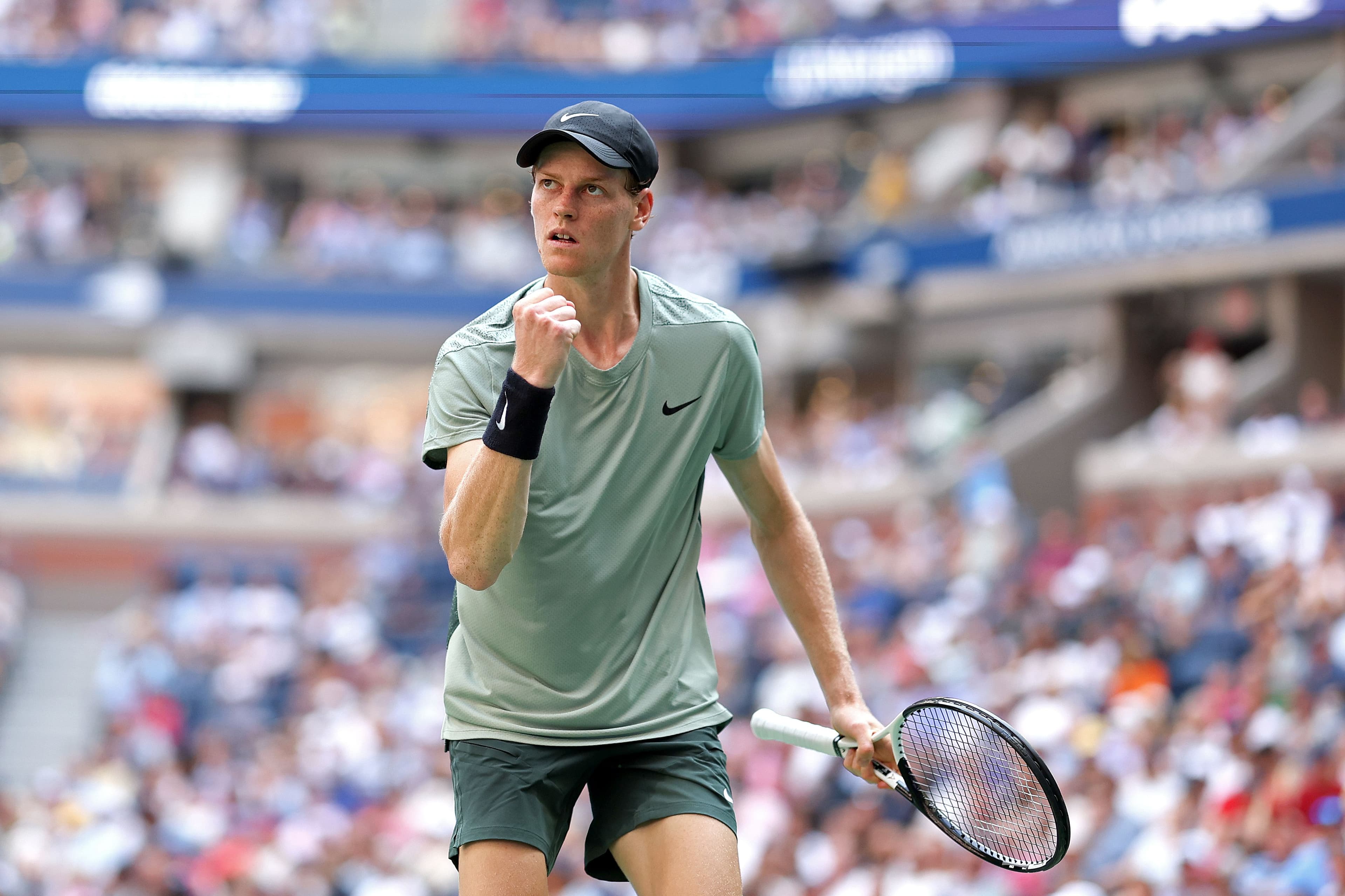 Jannik Sinner of Italy reacts after a point against Mackenzie McDonald.jpg