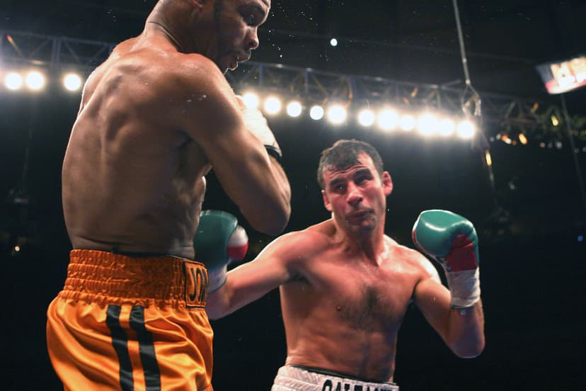 Joe Calzaghe defeats Roy Jones, Jr. in their Light Heavyweight boxing match