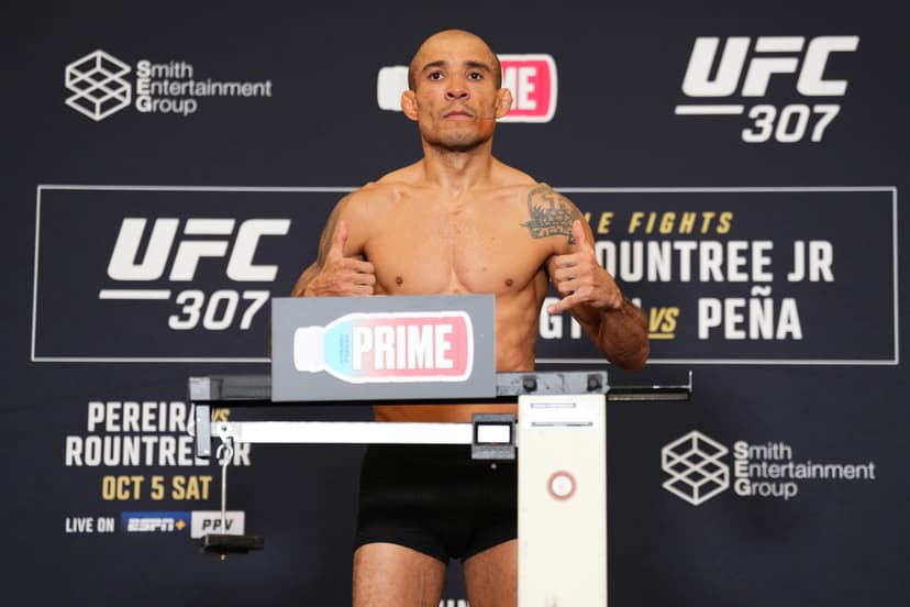 Jose Aldo of Brazil poses on the scale during the UFC 307