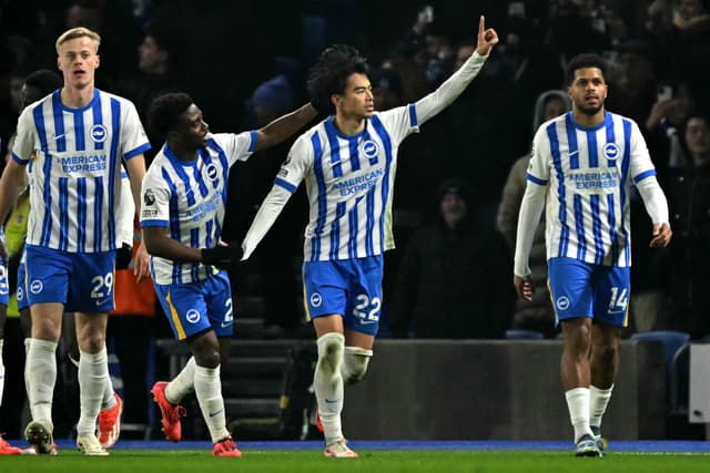 Kaoru Mitoma (C) celebrates scoring the opening goal during the English Premier League