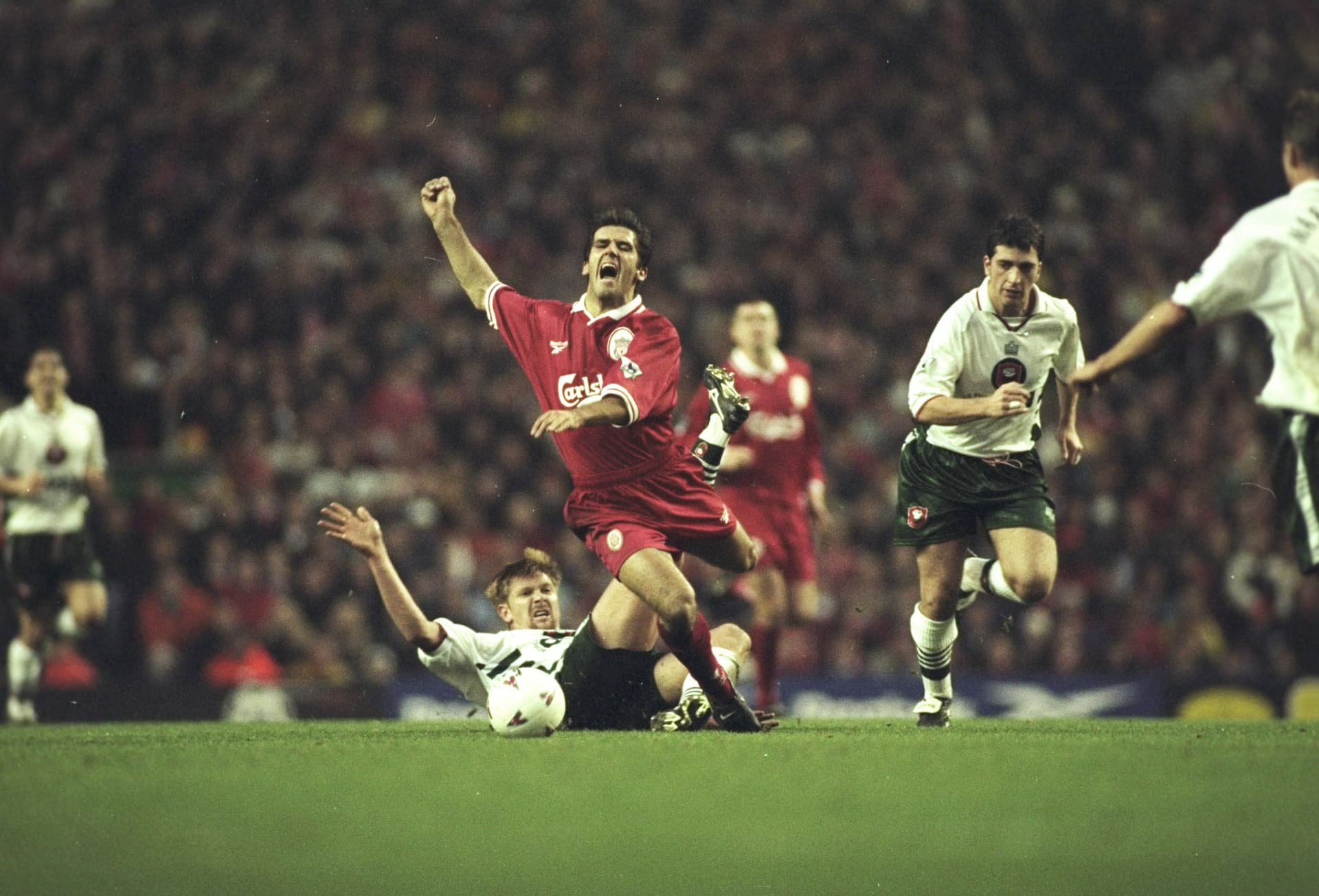 Karl Heinz Riedle of Liverpool is tackled by Neil Redfearn of Barnsley