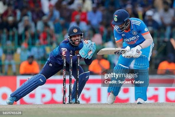 Kusal Mendis of Sri Lanka (L) unsuccessful stumping of KL Rahul of India.jpg