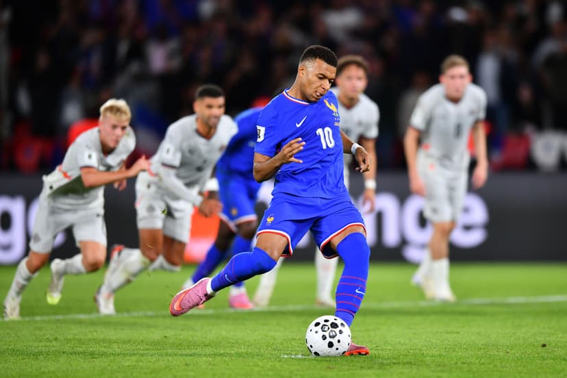 Kylian Mbappe of France scores his team's first goal