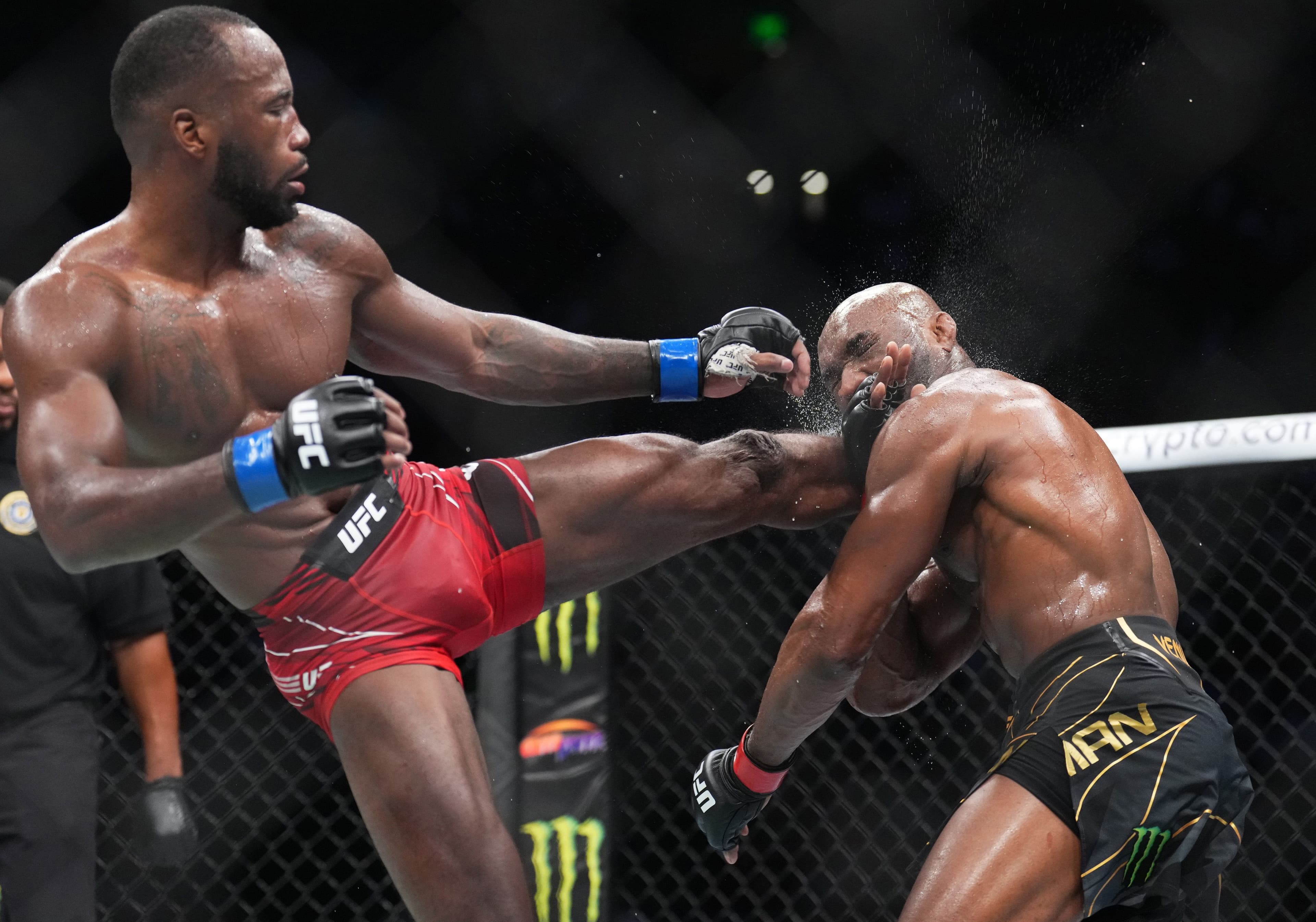 Leon Edwards lands a head kick to Kamaru Usman