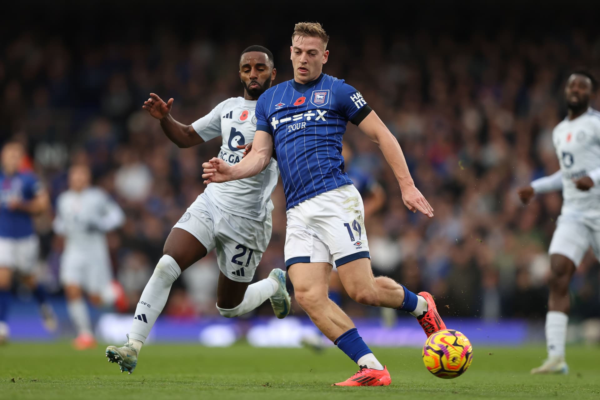 Liam Delap of Ipswich Town is challenged by Ricardo Pereira of Leicester City