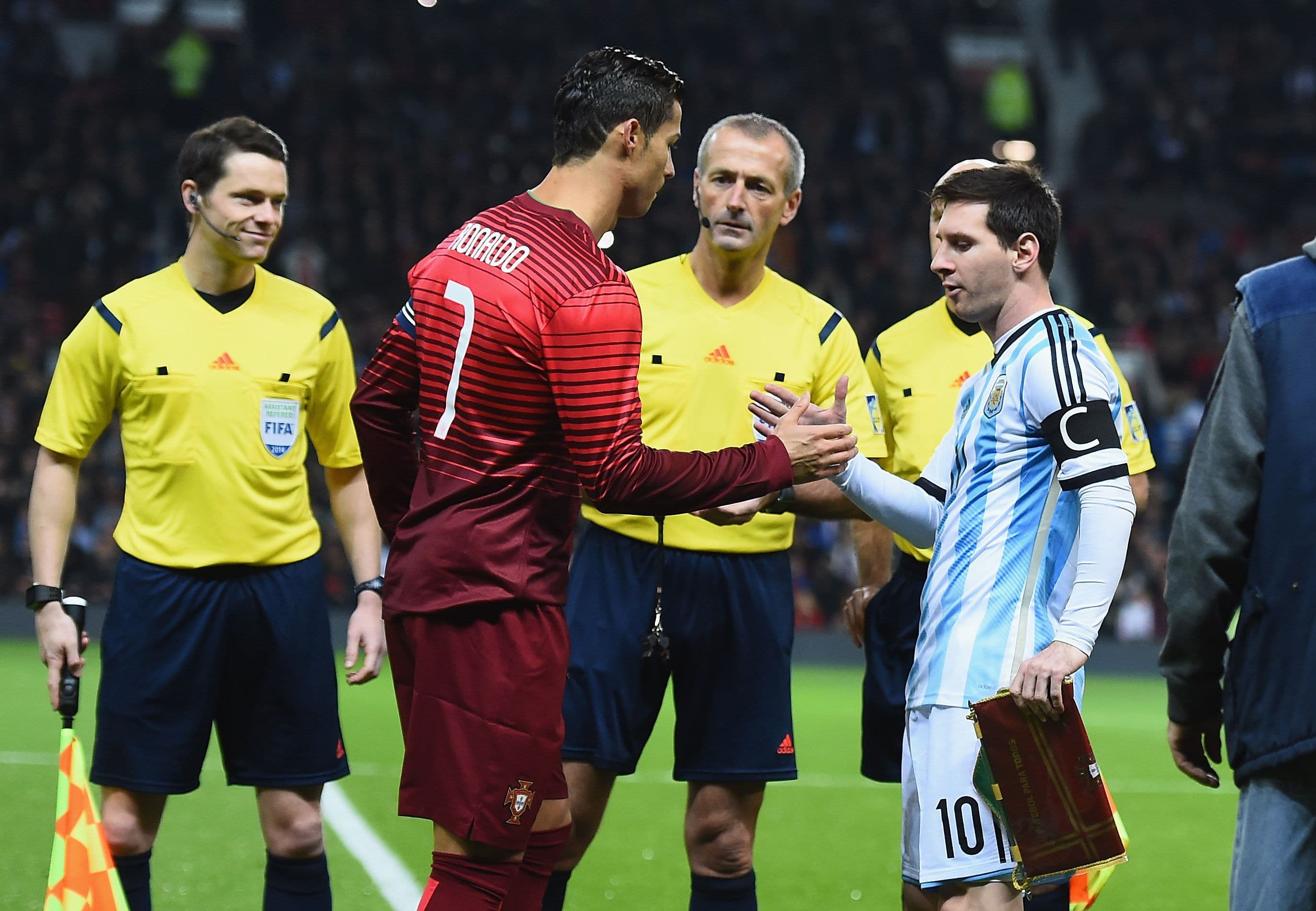 Lionel Messi of Argentina shakes hands with Cristiano Ronaldo