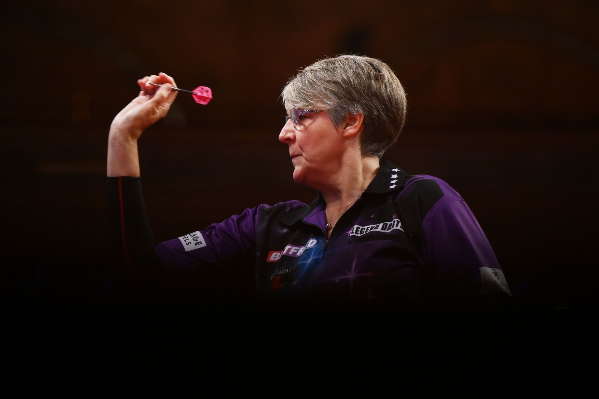 Lisa Ashton of England throws against Fallon Sherrock of England.jpg