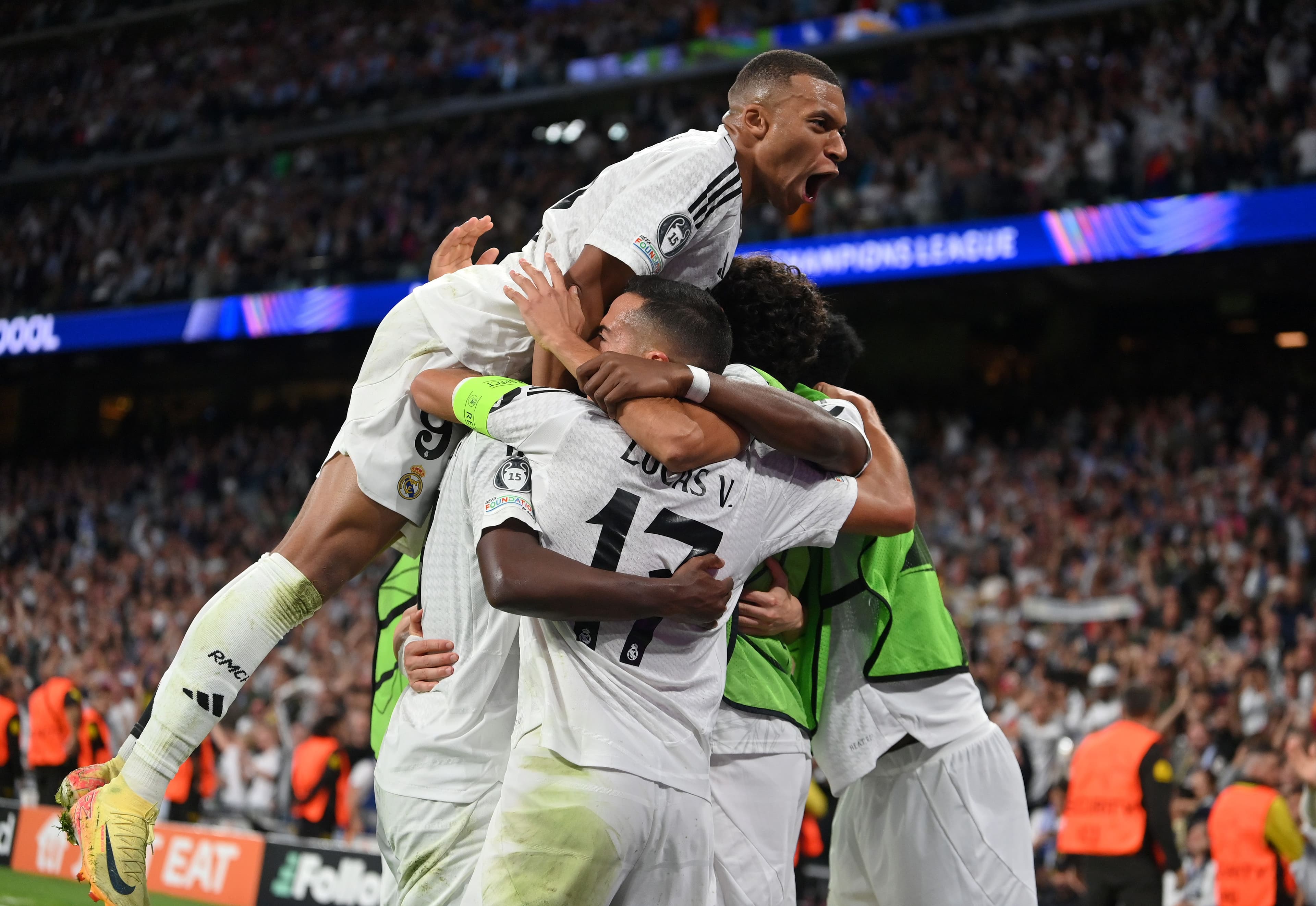 Lucas Vazquez of Real Madrid celebrates with teammates after scoring his team's third goal