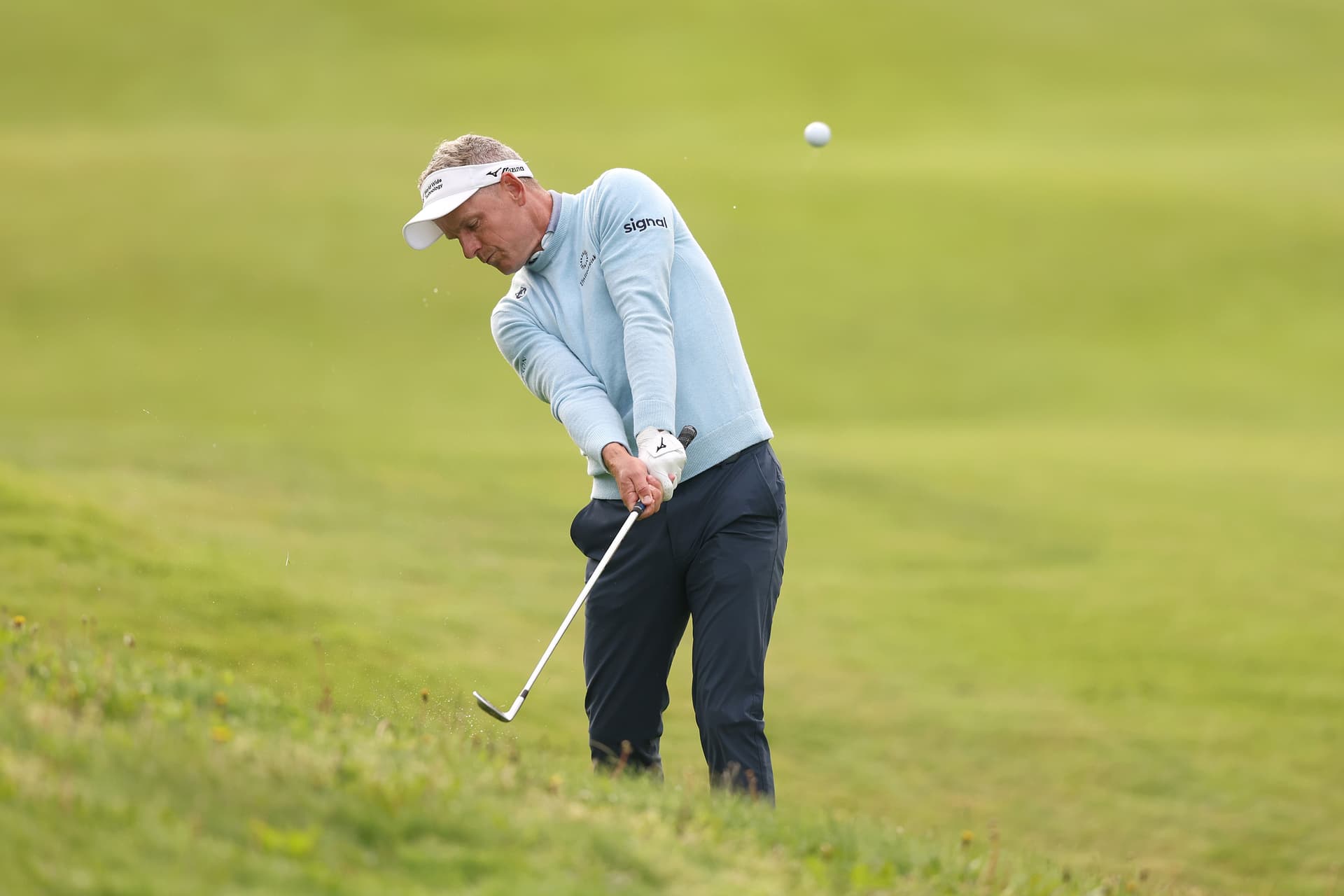 Luke Donald of England plays his second shot on the 11th hole