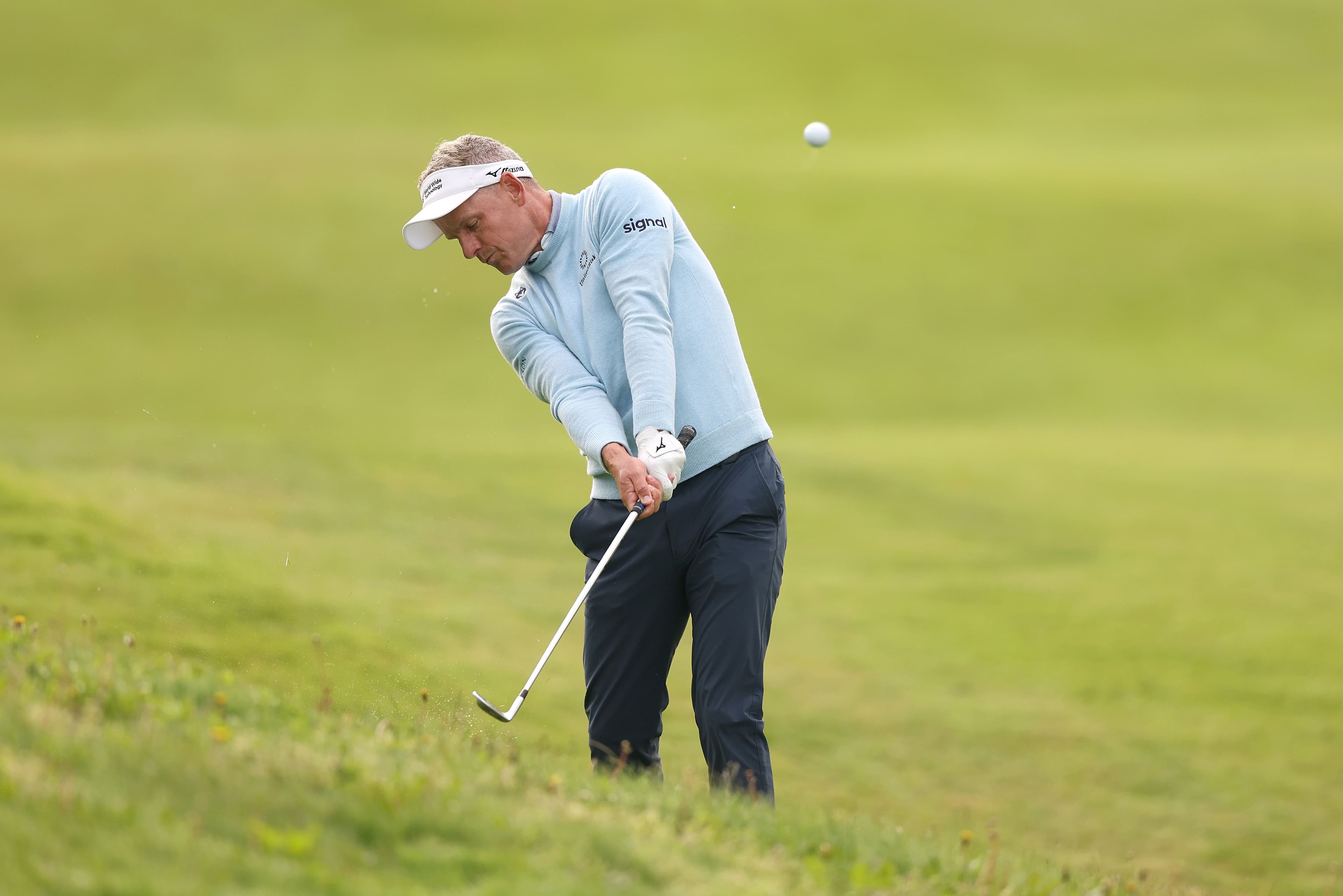 Luke Donald of England plays his second shot on the 11th hole