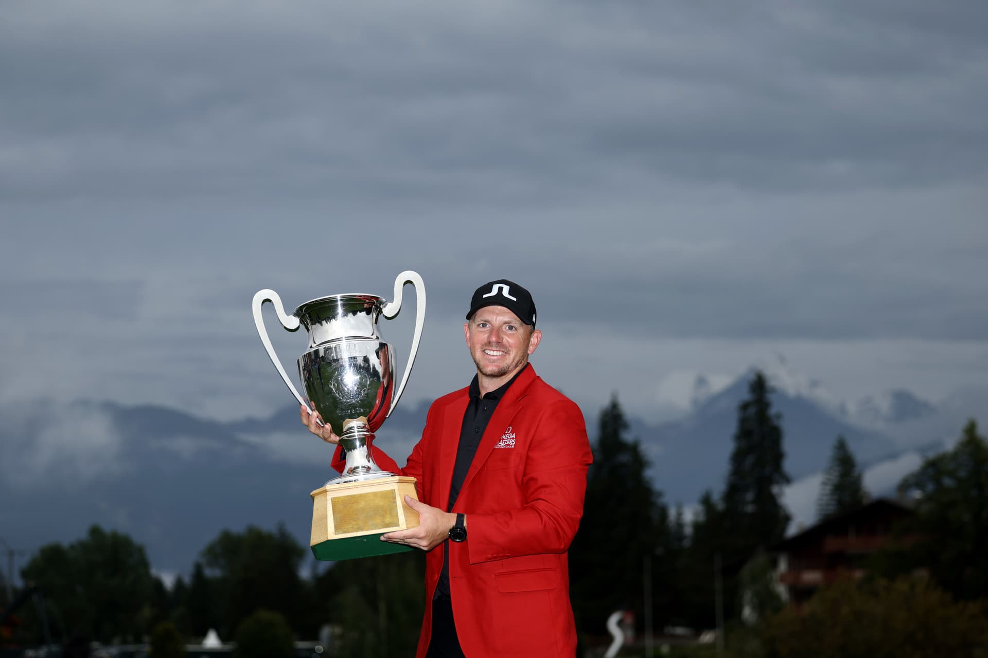 Matt Wallace of England poses with the Omega European Masters trophy
