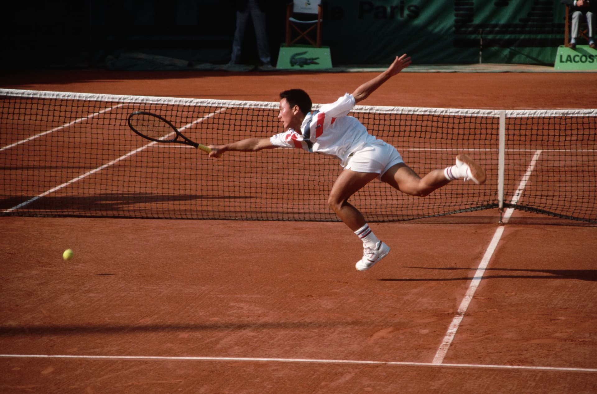 Michael Chang misses a shot at the net during the 1988 French Open