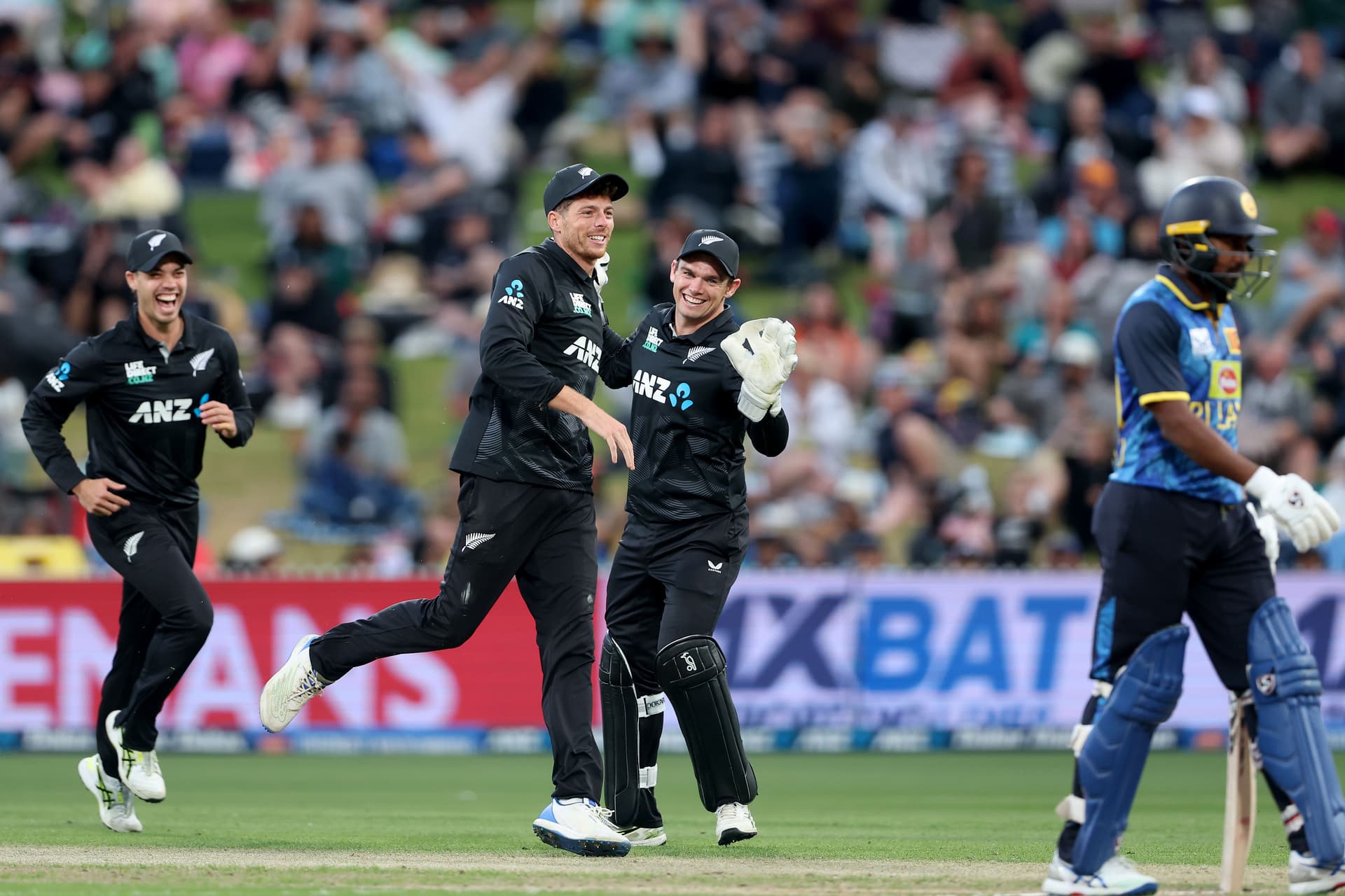 Mitchell Santner celebrates Charith Asalanka's runout