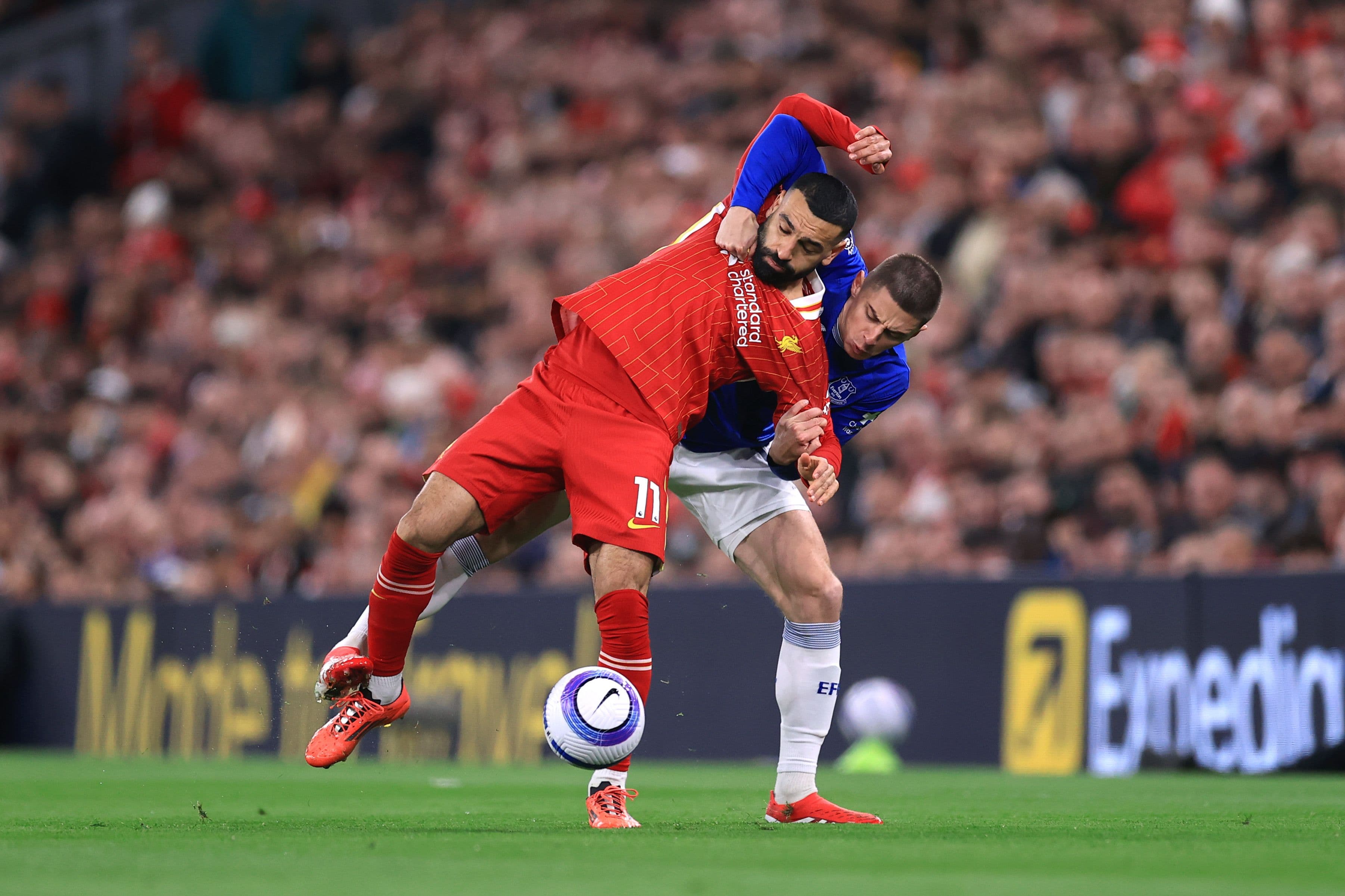 Mohamed Salah of Liverpool and Vitaliy Mykolenko of Everton