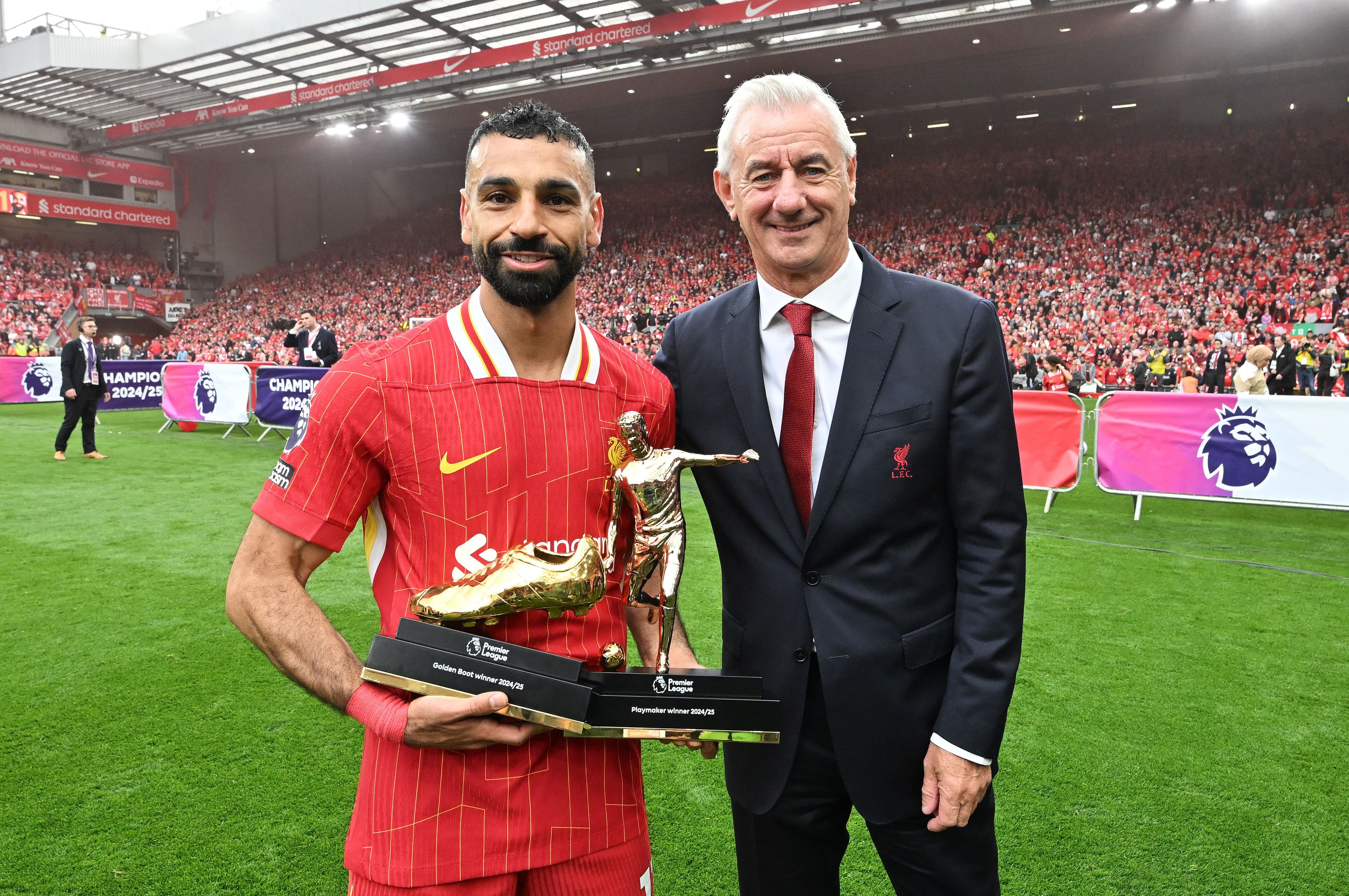 Mohamed Salah of Liverpool poses for a photograph as he is presented with the Premier League