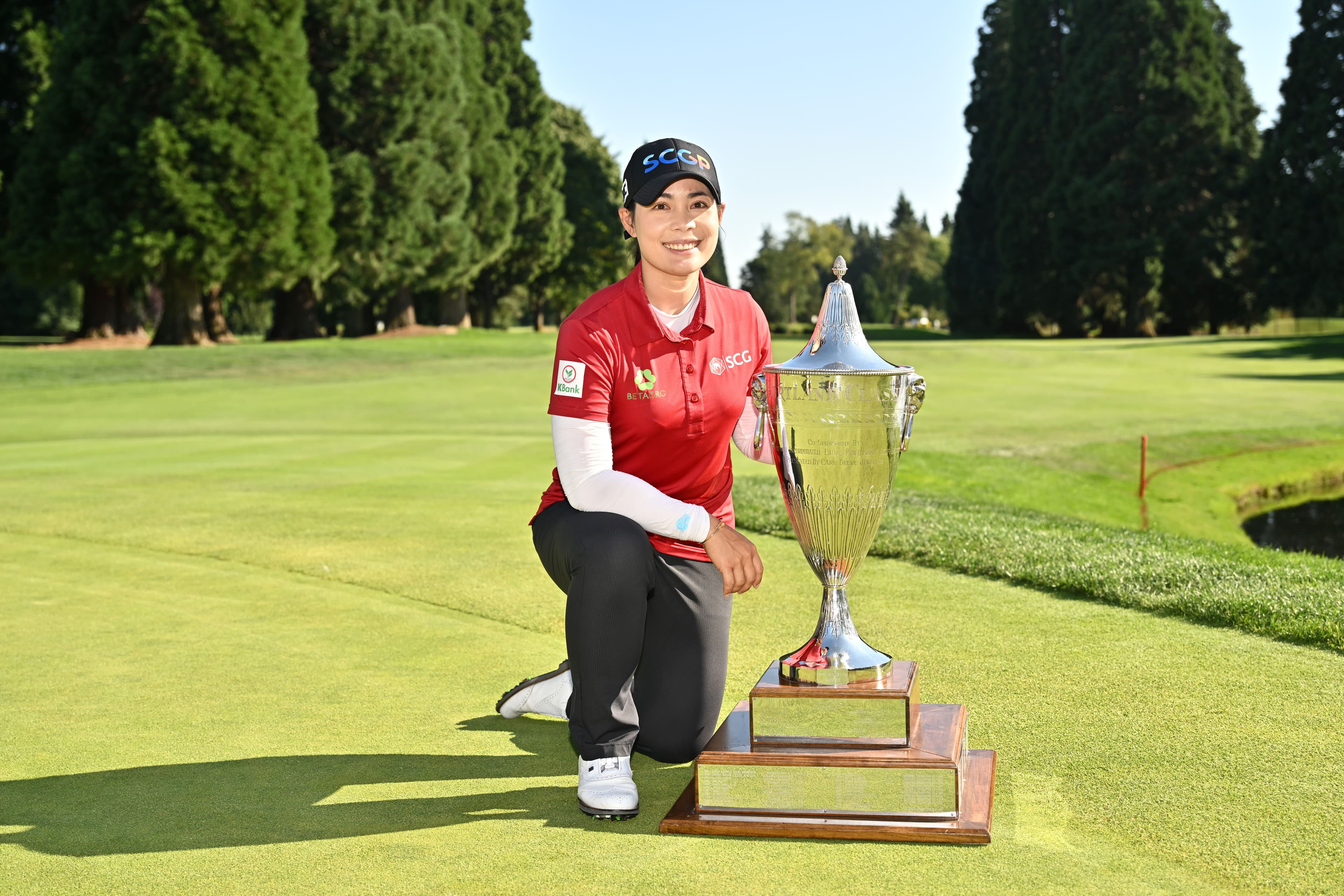 Moriya Jutanugarn of Thailand poses with the trophy after the final round