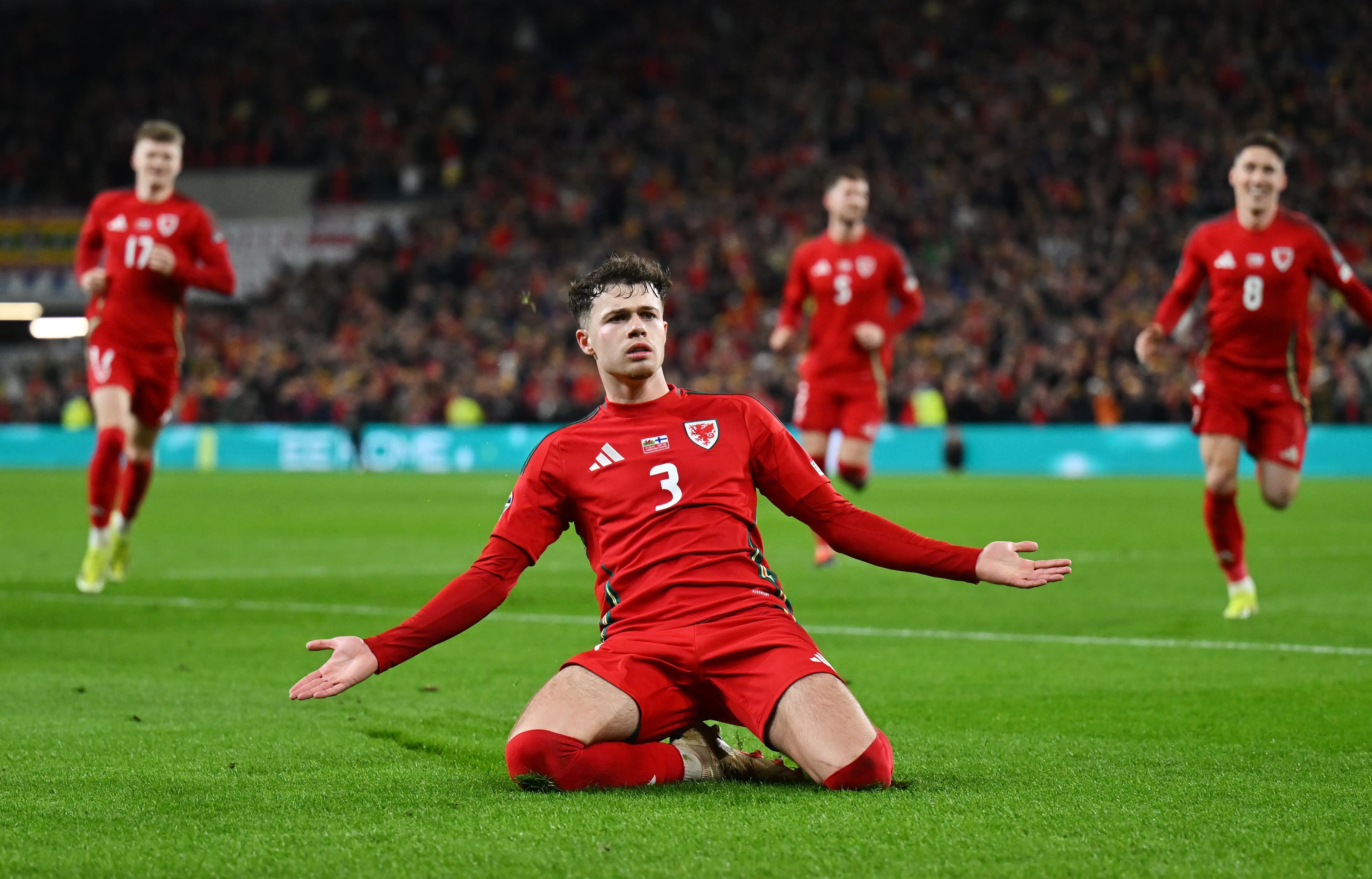 Neco Williams of Wales celebrates scoring his team's second goal