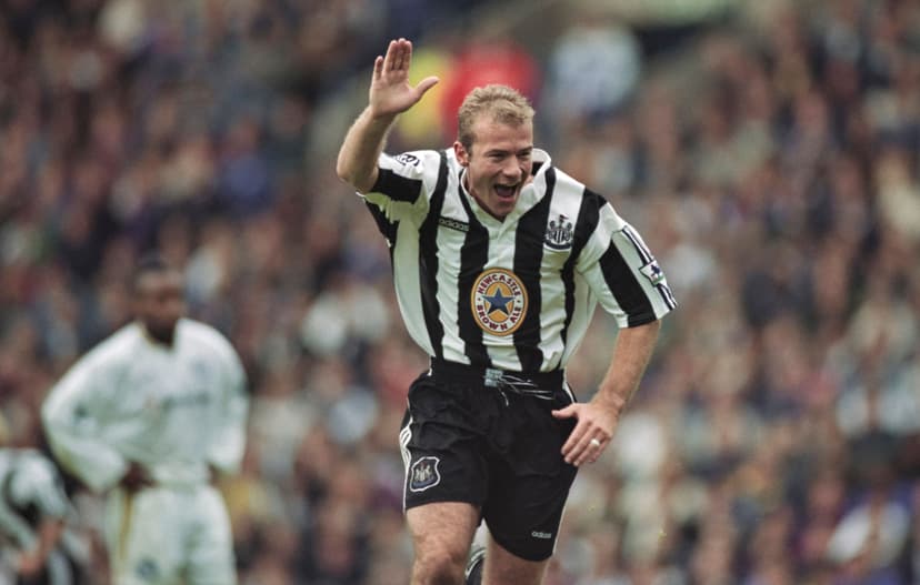 Newcastle United striker Alan Shearer celebrates with his trademark one armed salute