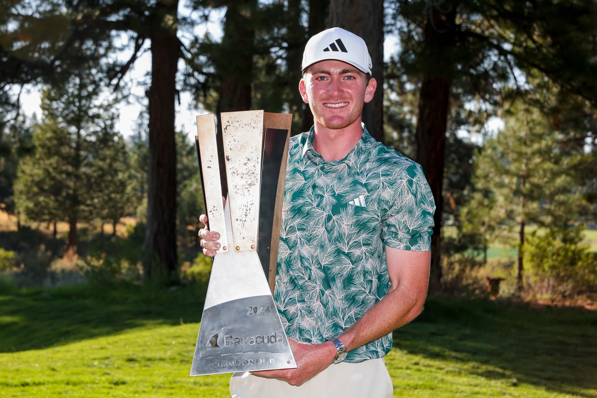 Nick Dunlap poses with the trophy after winning the Barracuda Championship