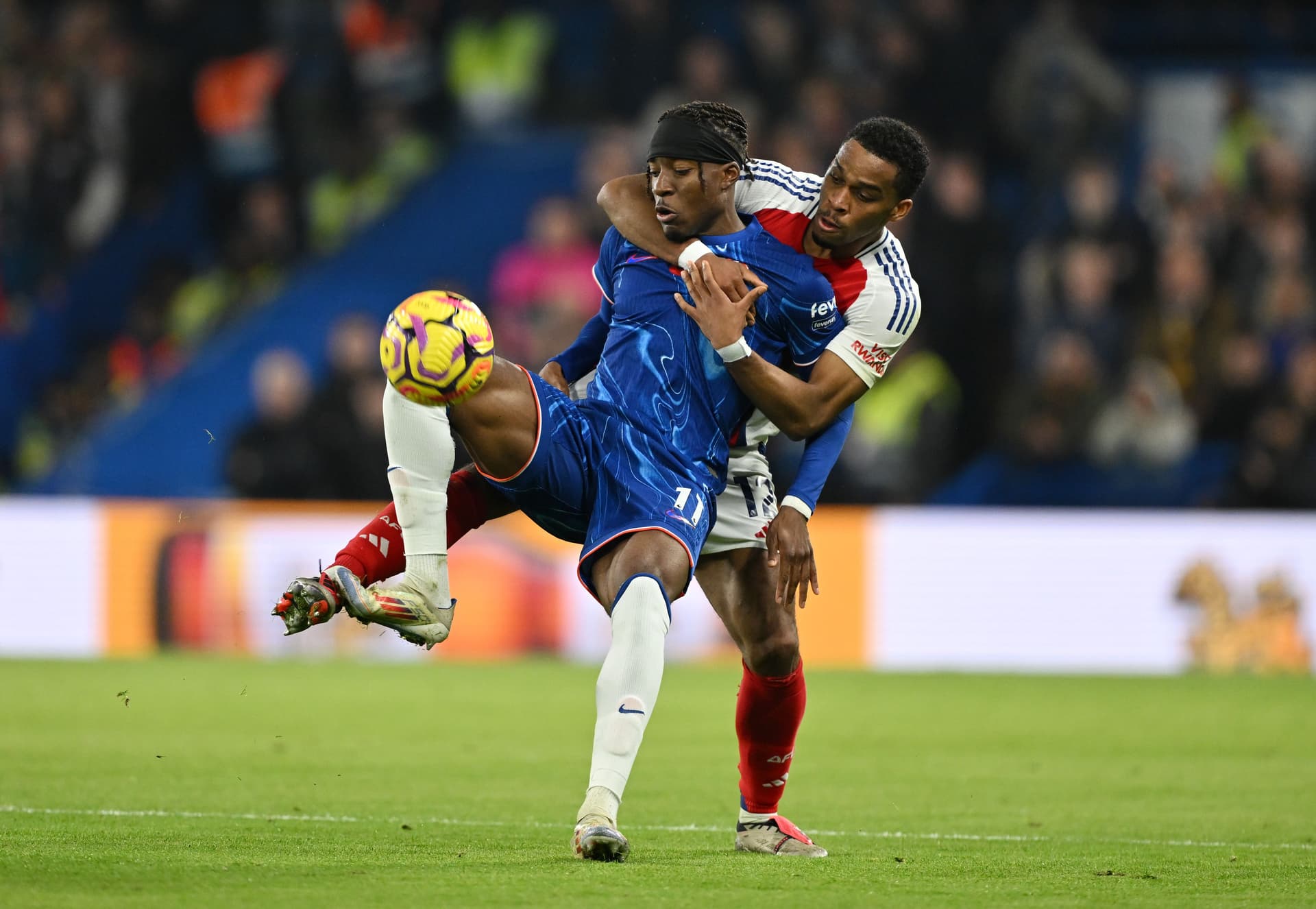 Noni Madueke of Chelsea is fouled by Jurrien Timber